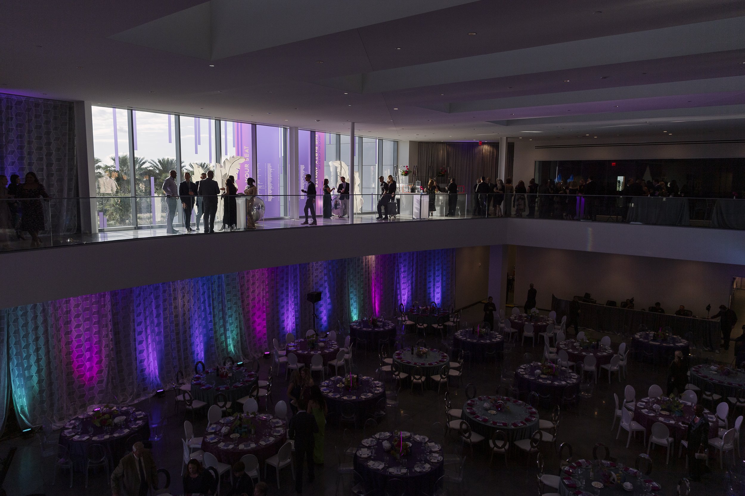 Guests Looking at Escort Sign Vinyl on Large Windows at Corporate Gala Event