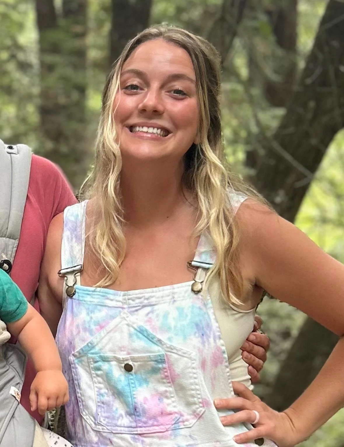 Lindsey Nowak, Family Adventure Squad team member, smiling in a forest