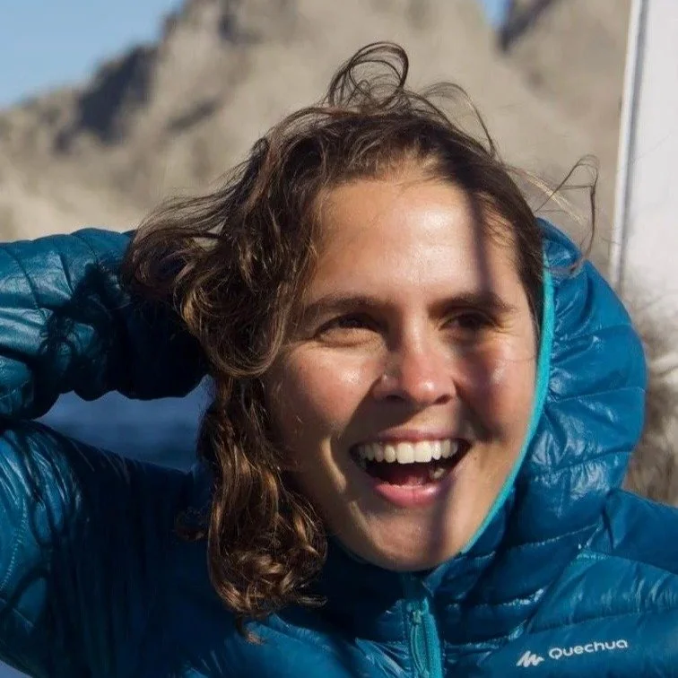 Arren Mendezona Allegretti, Family Adventure Squad nature guide, laughing in the wind on a mountain outing