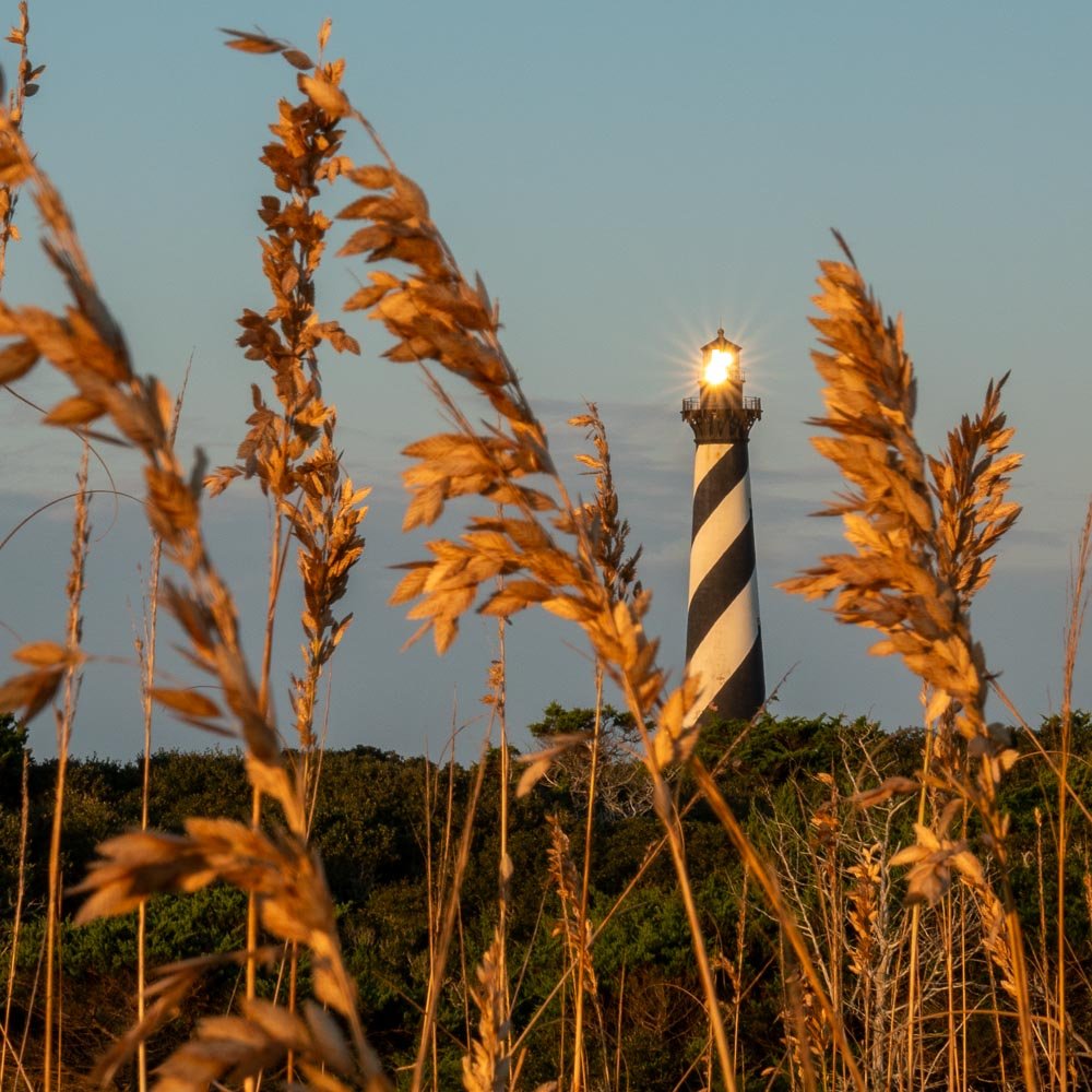 Heading back for a second cup of coffee as the Sun takes its turn lighting up the lamp house.