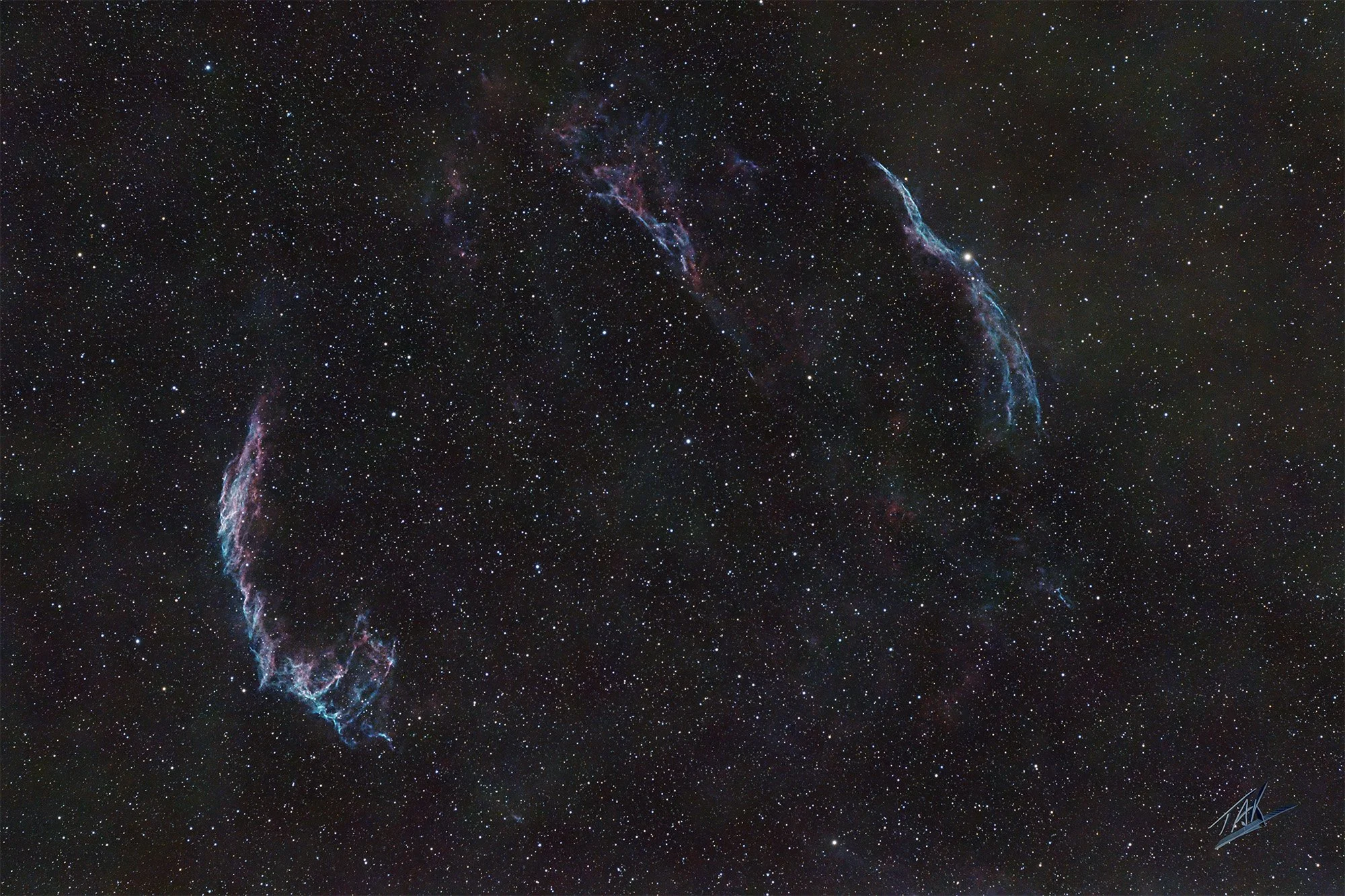 You really need darker skies to get the best photos of this ghostly Veil Nebula.  It is cloud of heated and ionized gas and dust found in the constellation Cygnus.  These East and West portions are what remain from a super nova, or explosion of a sta