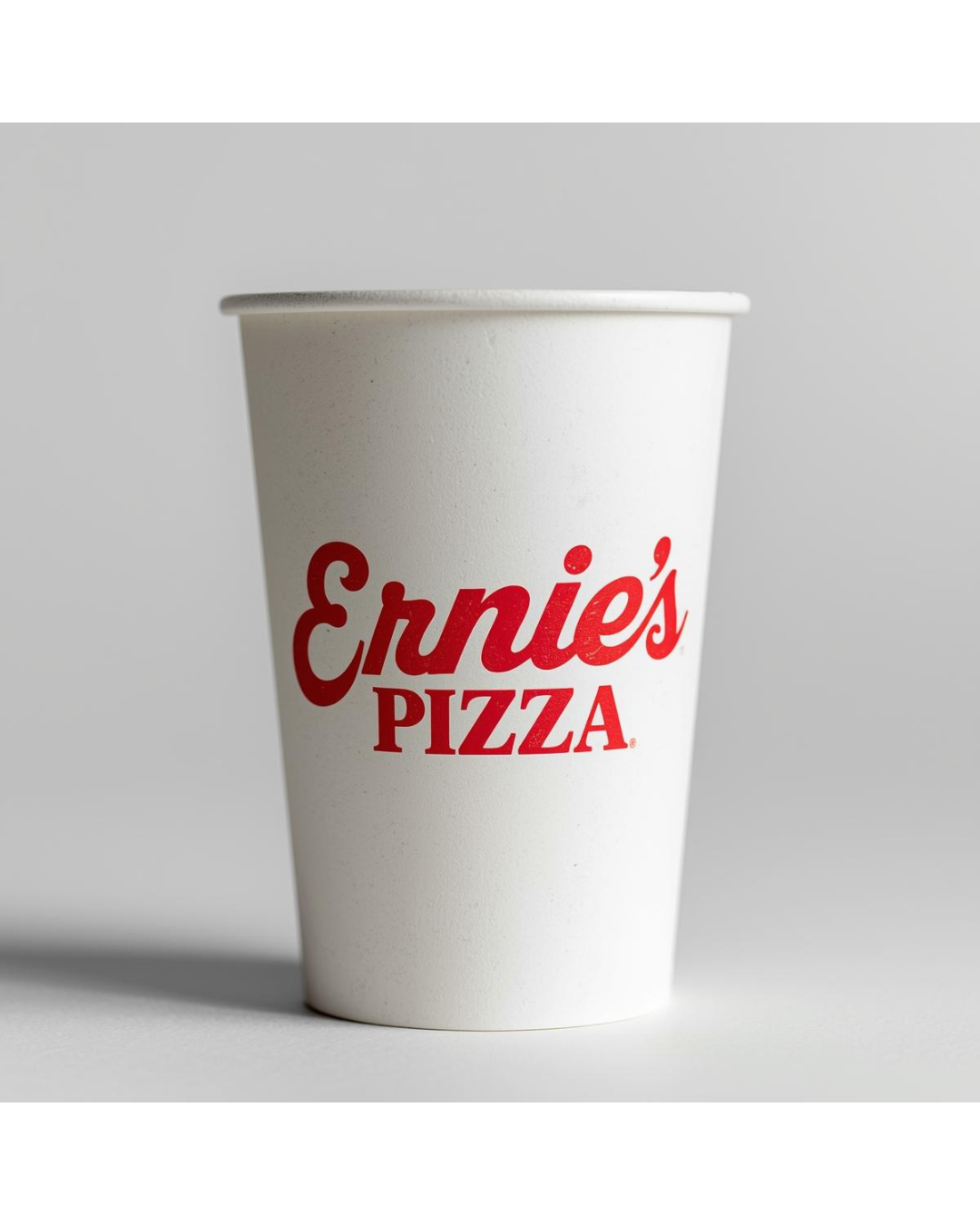 A white paper soda cup with red logo reading 'Ernie's PIZZA' on a plain white background.