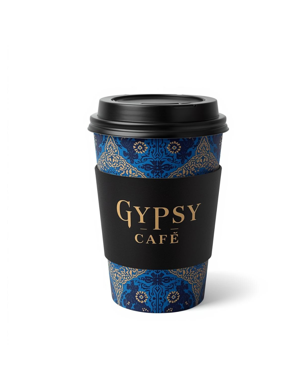 A disposable coffee cup with a black lid, decorated with a blue and gold ornate pattern, and a black sleeve featuring the text 'GYSY CAFÉ' in gold letters.
