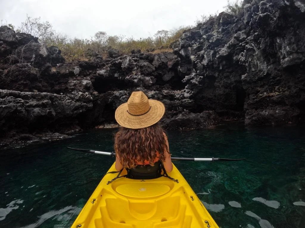 women on a kayak in san cristobal island galapagos