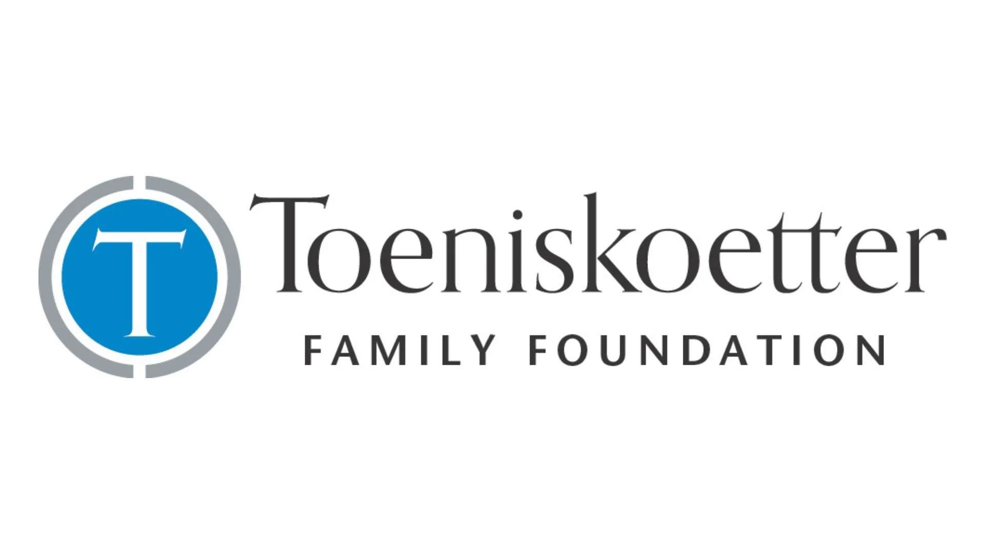 Logo of Toenskotter Family Foundation, featuring a blue circle with a white letter T, surrounded by a gray ring, and black text with the foundation's name.