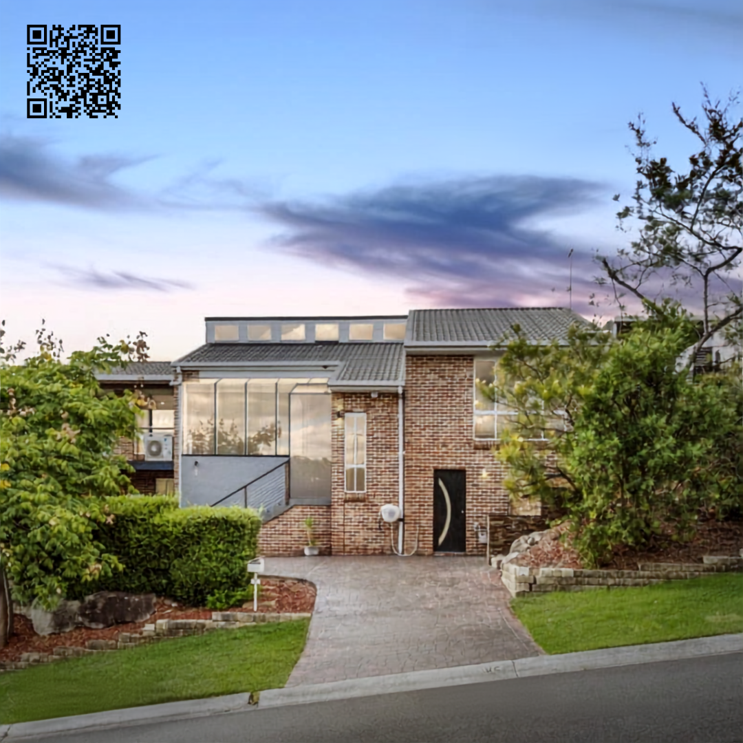 Modern brick house with large windows, a driveway, and landscaped yard with trees and shrubs.