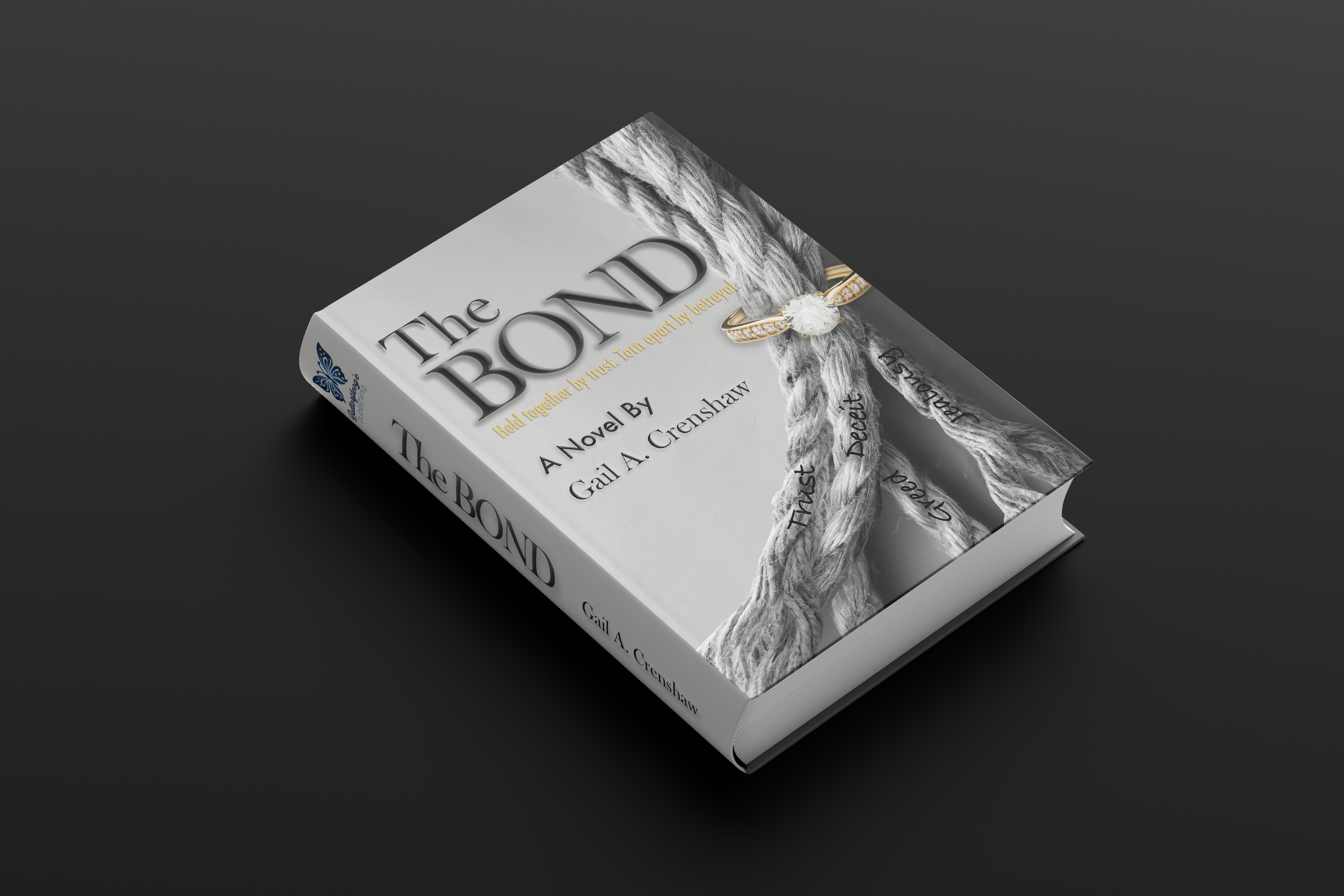 A hardcover book titled 'The Bond' by Gail A. Crenshaw on a dark surface, featuring a cover with a braided rope and a ring, with inscriptions 'Trust,' 'Grace,' and 'Believe' on the rope.