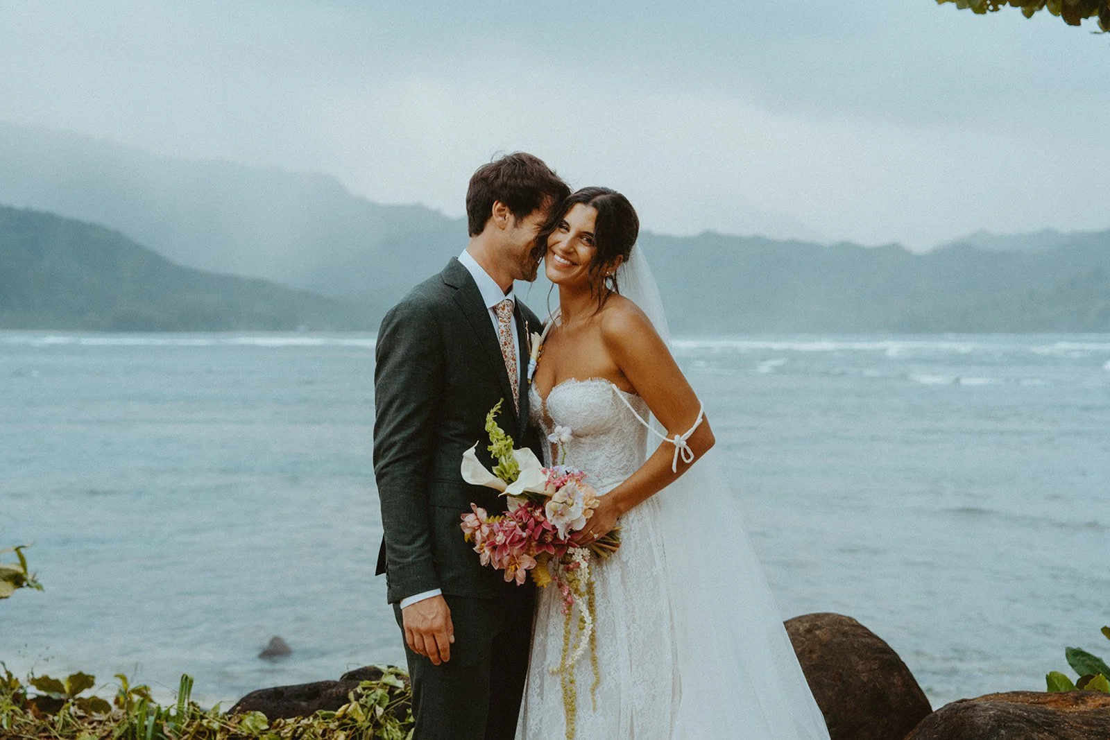 Kaua‘i bride with elegant wedding hair and makeup at 1 Hotel Hanalei Bay. Photo by Brooke Stonely.