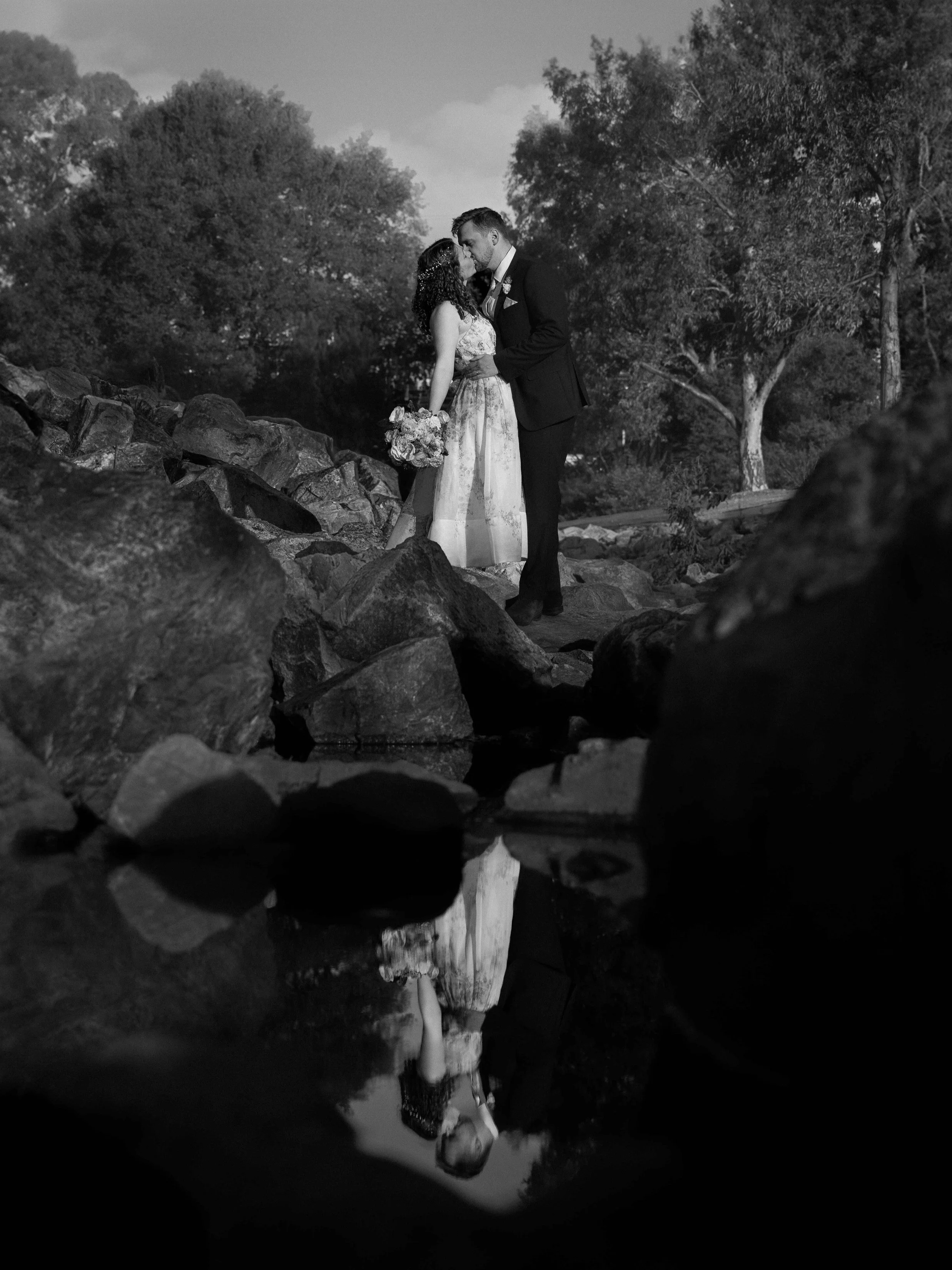 Adelaide botanic gardens bride and groom kissing water reflection