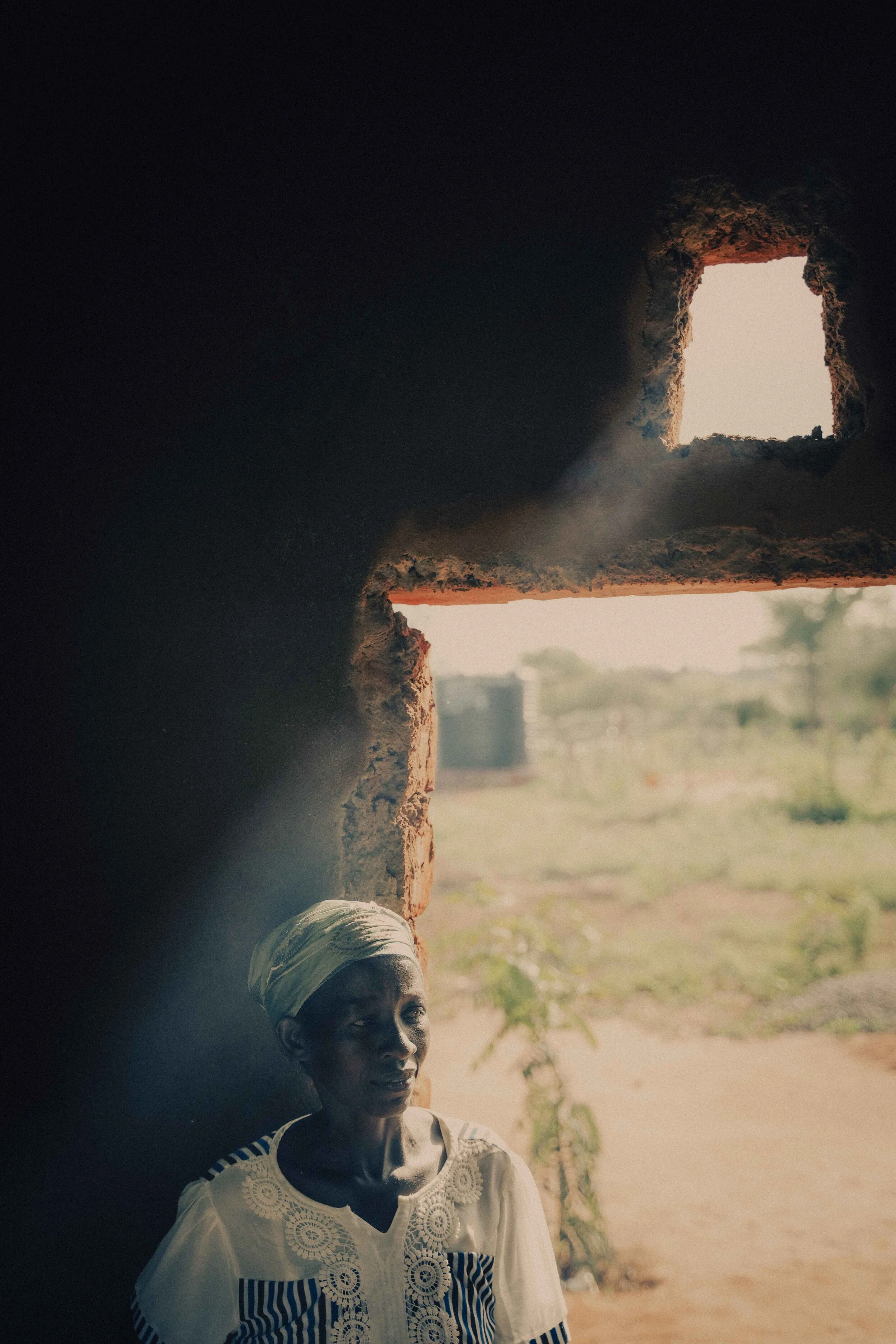 lady in kitchen hut Kenya
