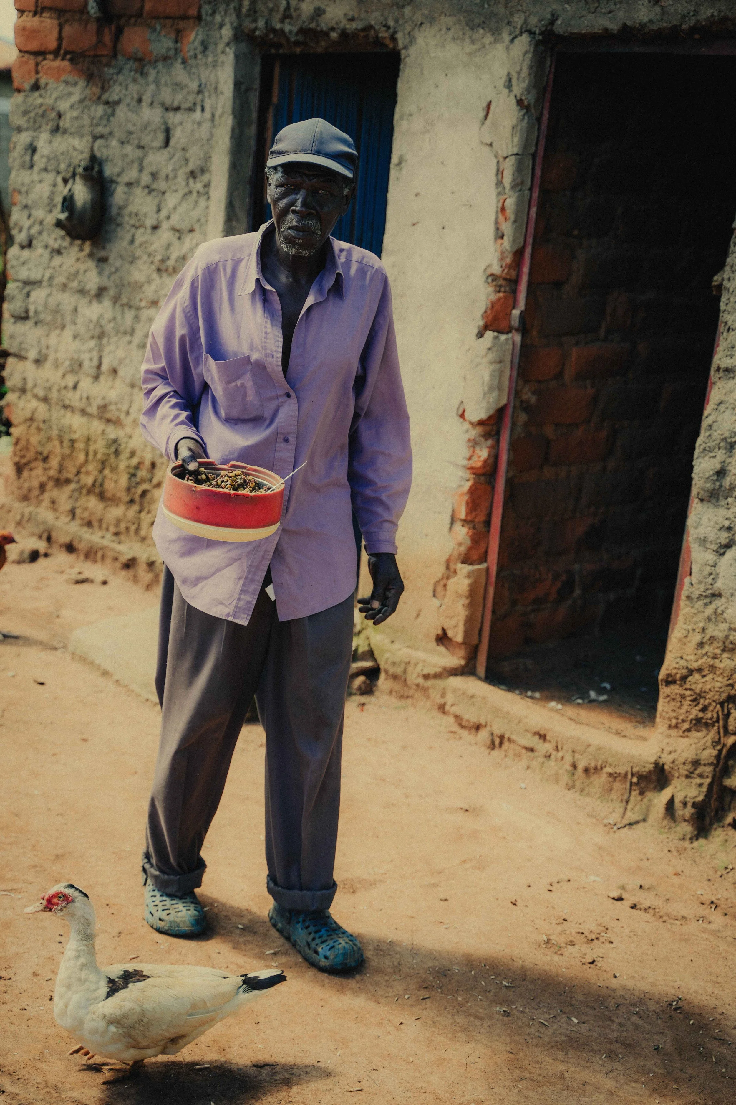 man with food and a duck Kenya