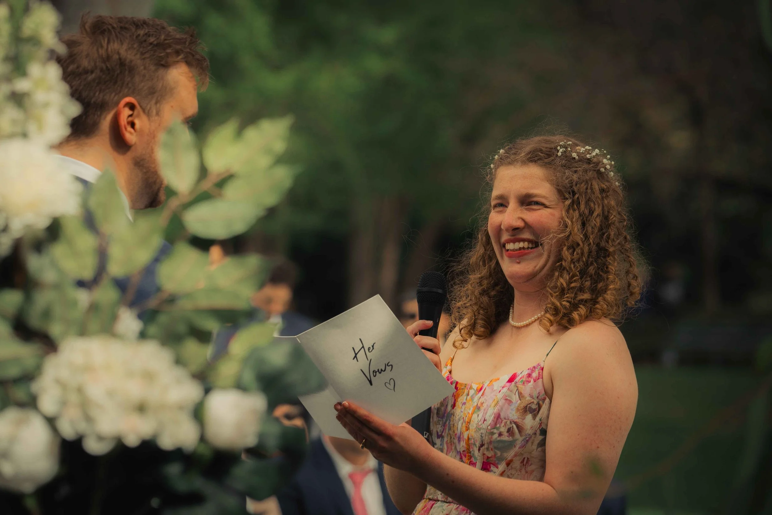 bride and groom laughing vows colourful bridal dress