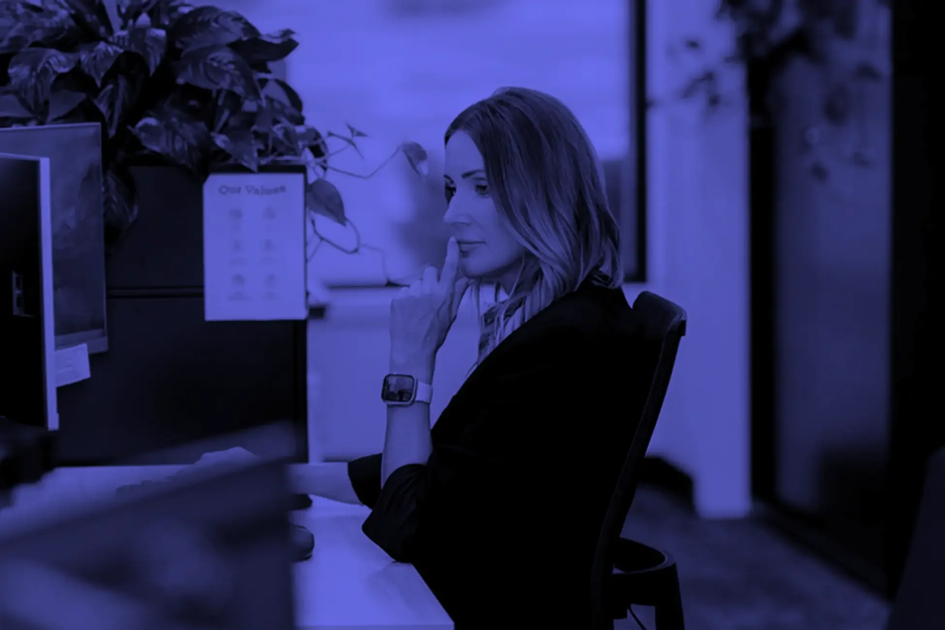 Client testimonial for Assembl Studio featuring feedback from Lindsey Shaw of Yovich Advisory Ltd working at her desk