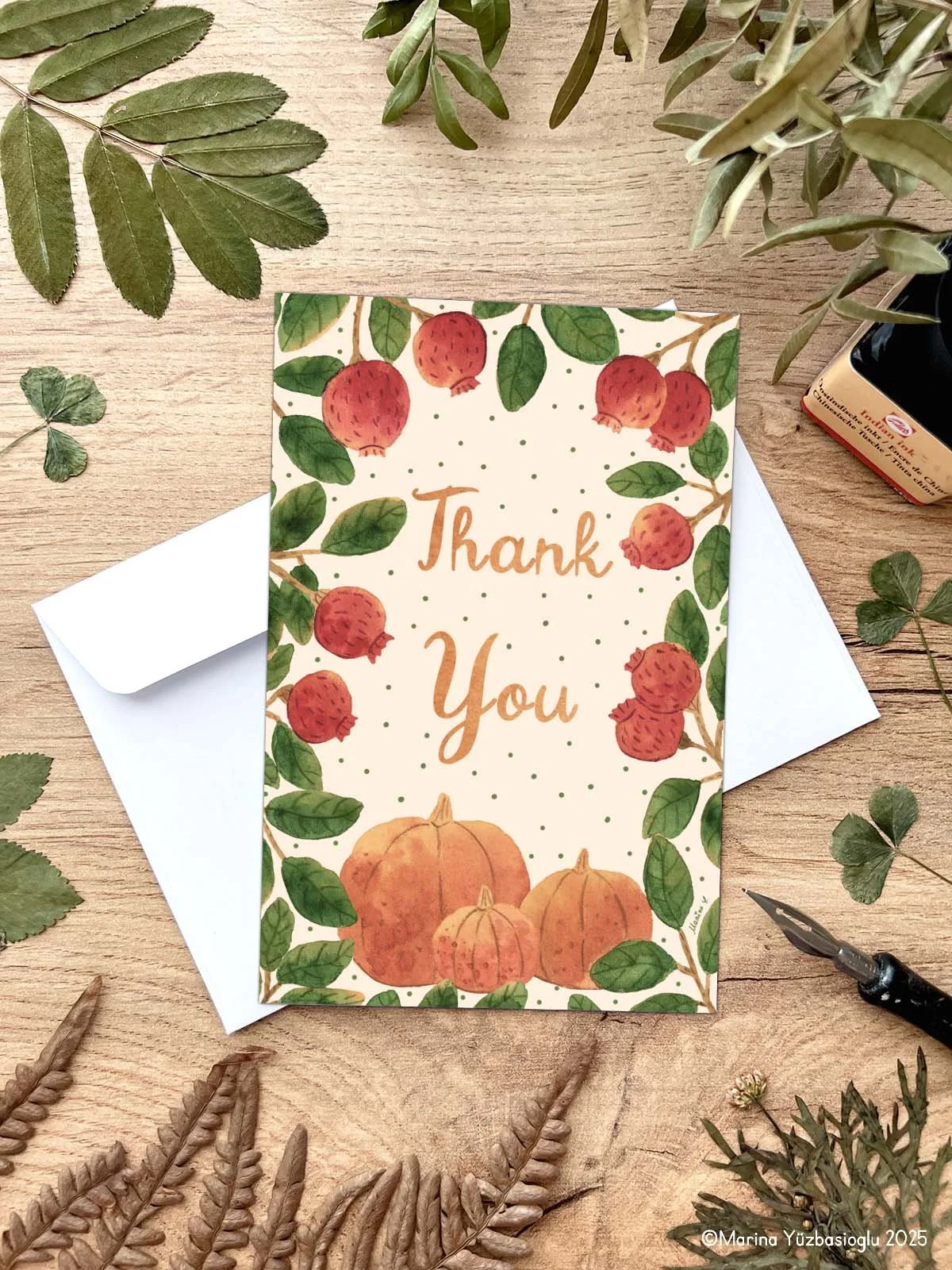 Featuring hand-painted pumpkins, delicate florals, and elegant hand lettering, this card evokes a cozy autumn atmosphere—perfect for sending heartfelt thank-you notes.