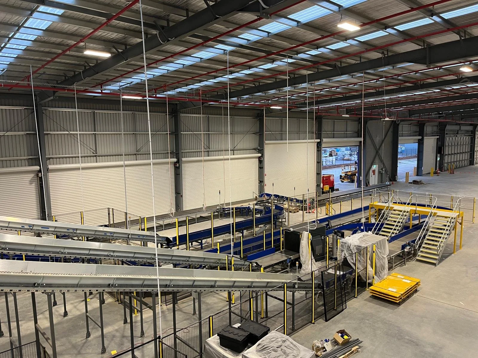 Empty warehouse with conveyor belts, staircases, and storage areas under construction.

Electrician Northern Rivers
Electrician Northern Rivers
Commercial electrician Northern Rivers
Emergency electrician Northern Rivers