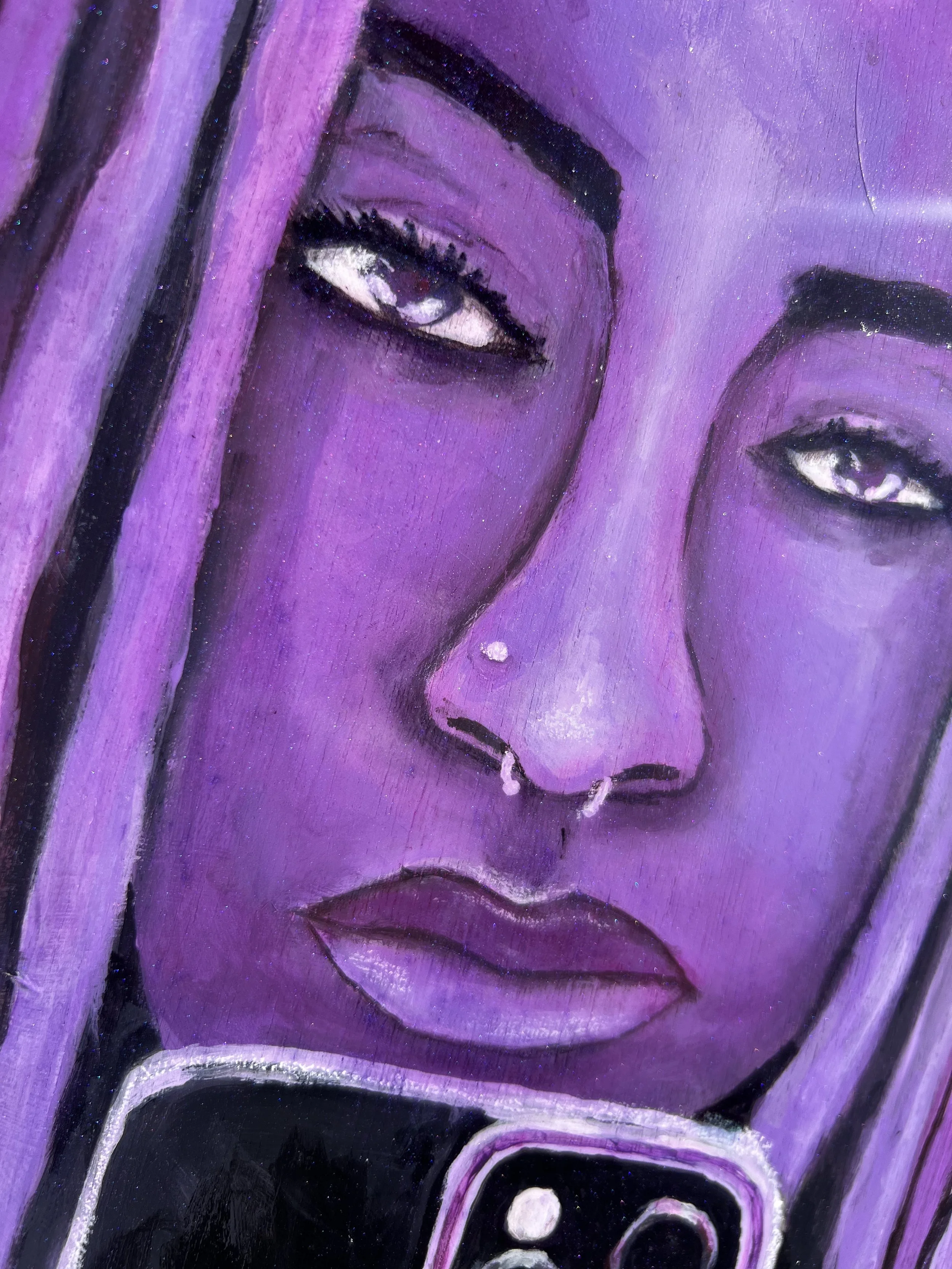 Close-up of a purple-toned painting of a woman with long hair, wearing nose piercings, with her face reflected on a smartphone camera.