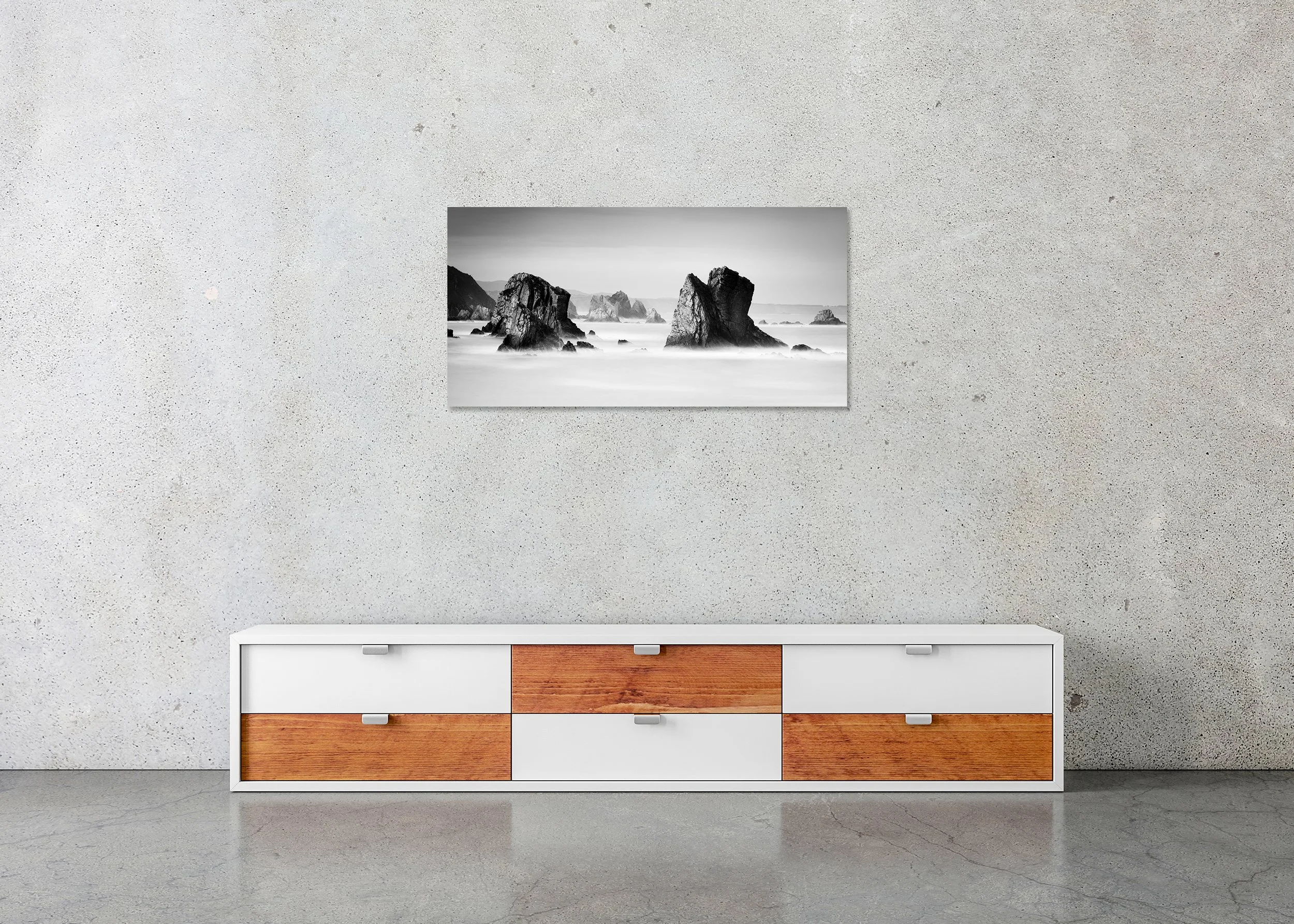 Black-and-white long-exposure photograph of sea rock formations at Playa del Silencio in Asturias, Spain on a frameless ChromaLuxe metal print.