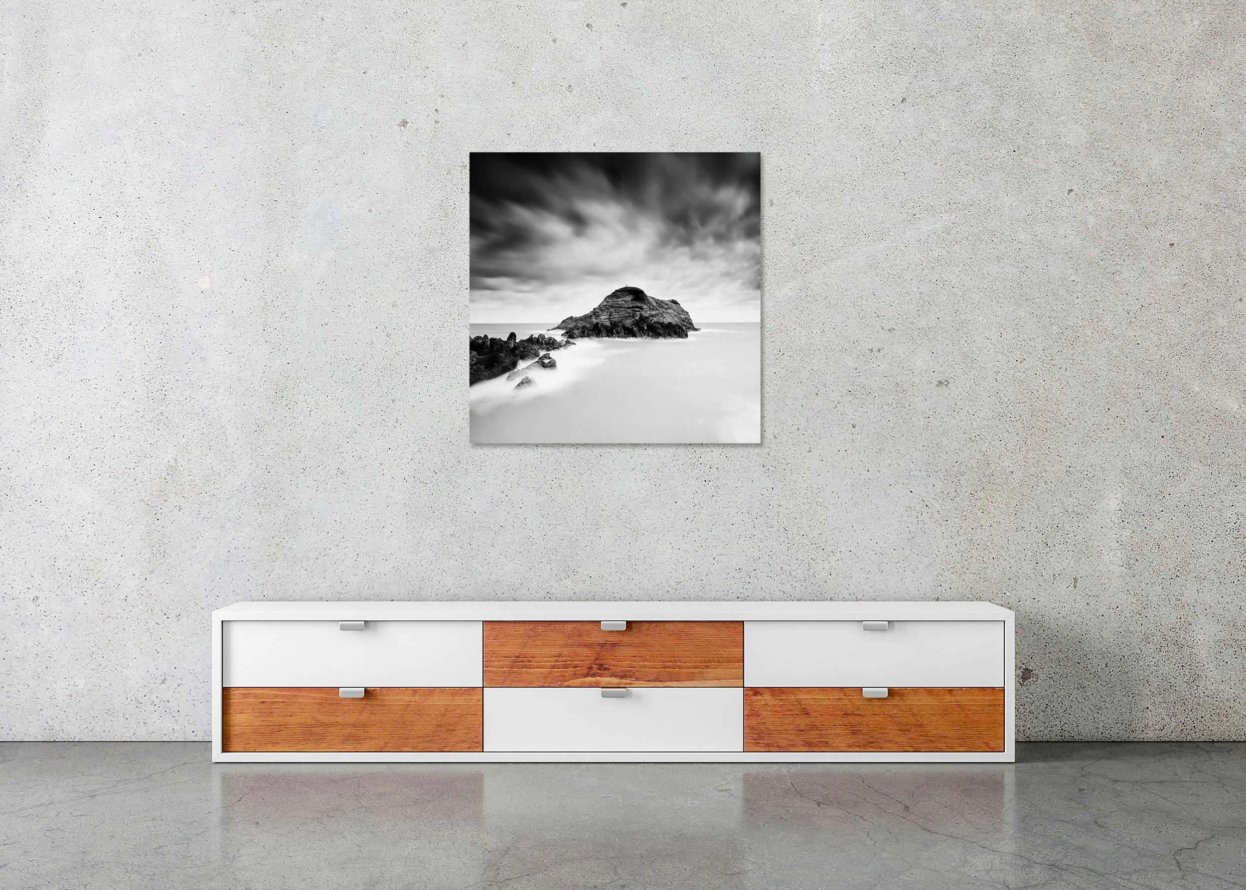 Black-and-white long-exposure seascape of a rocky island beneath dramatic clouds, ChromaLuxe metal print, frameless.