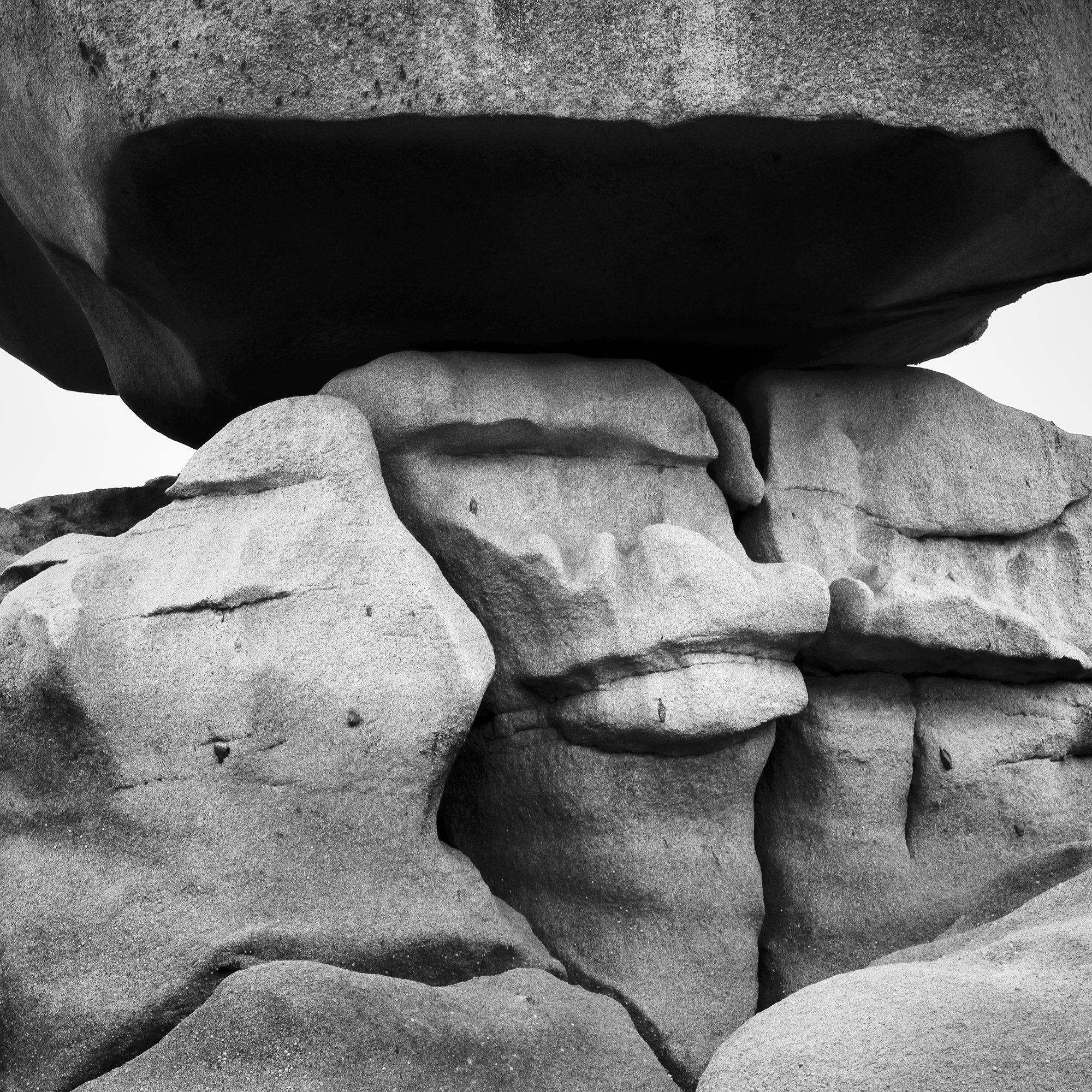 Pink Granite Coast Panorama Study 2 by Gerald Berghammer, black-and-white detail revealing natural granite textures and the central supporting rocks.