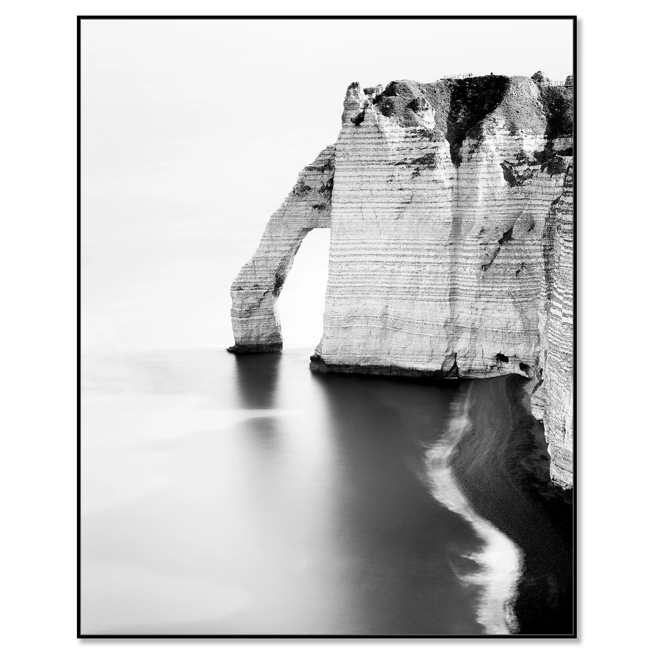 The Sea Arch at Étretat, France, black-and-white Dibond print in a black aluminium ArtBox. Photo by Gerald Berghammer.