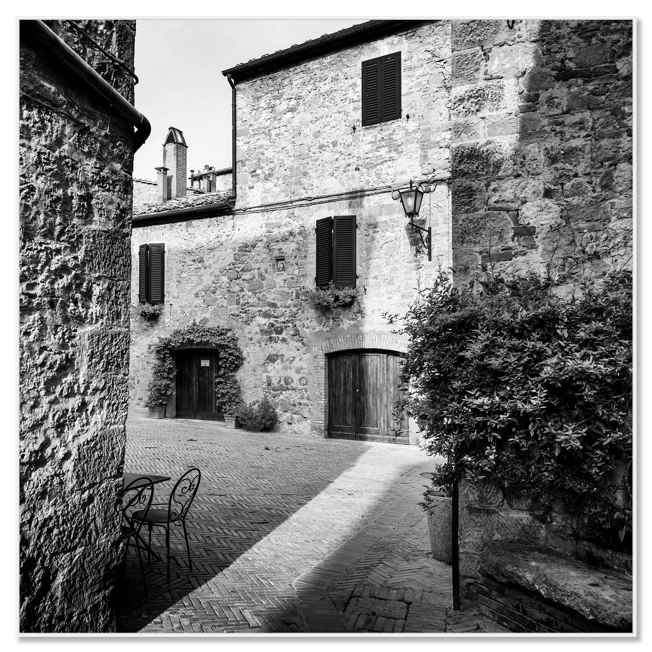 Tuscan Courtyard, Study 1 – black-and-white photograph in a white aluminium ArtBox frame.