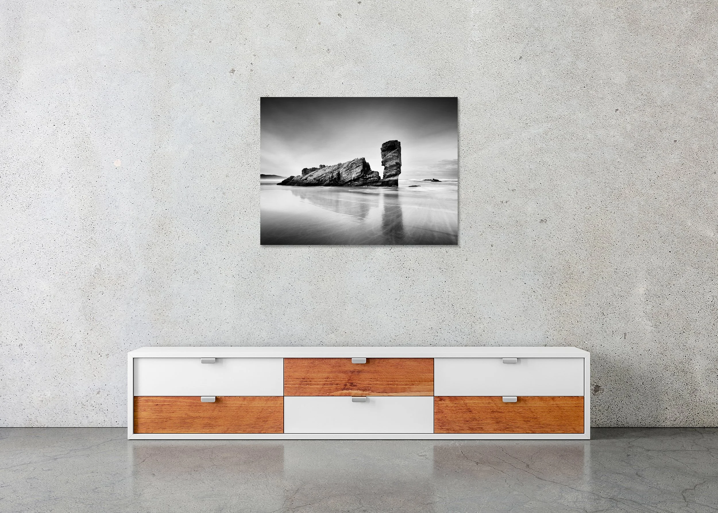 Monochrome long-exposure seascape print of a tall sea stack on a quiet beach, photo print mounted to Dibond, frameless