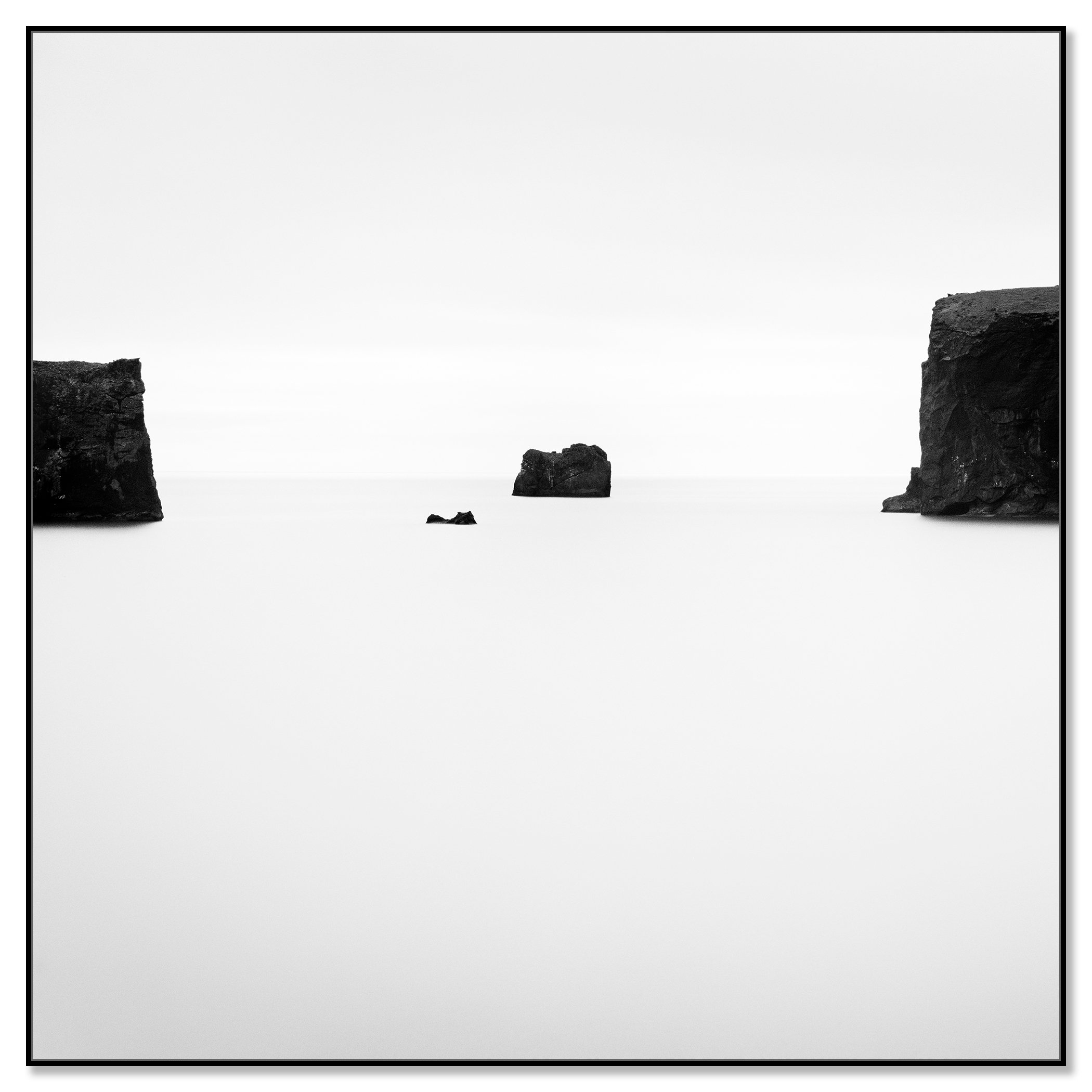 Black Rocks Study 2 – Iceland, black-and-white photograph on aluminium Dibond in a black ArtBox frame by Gerald Berghammer.