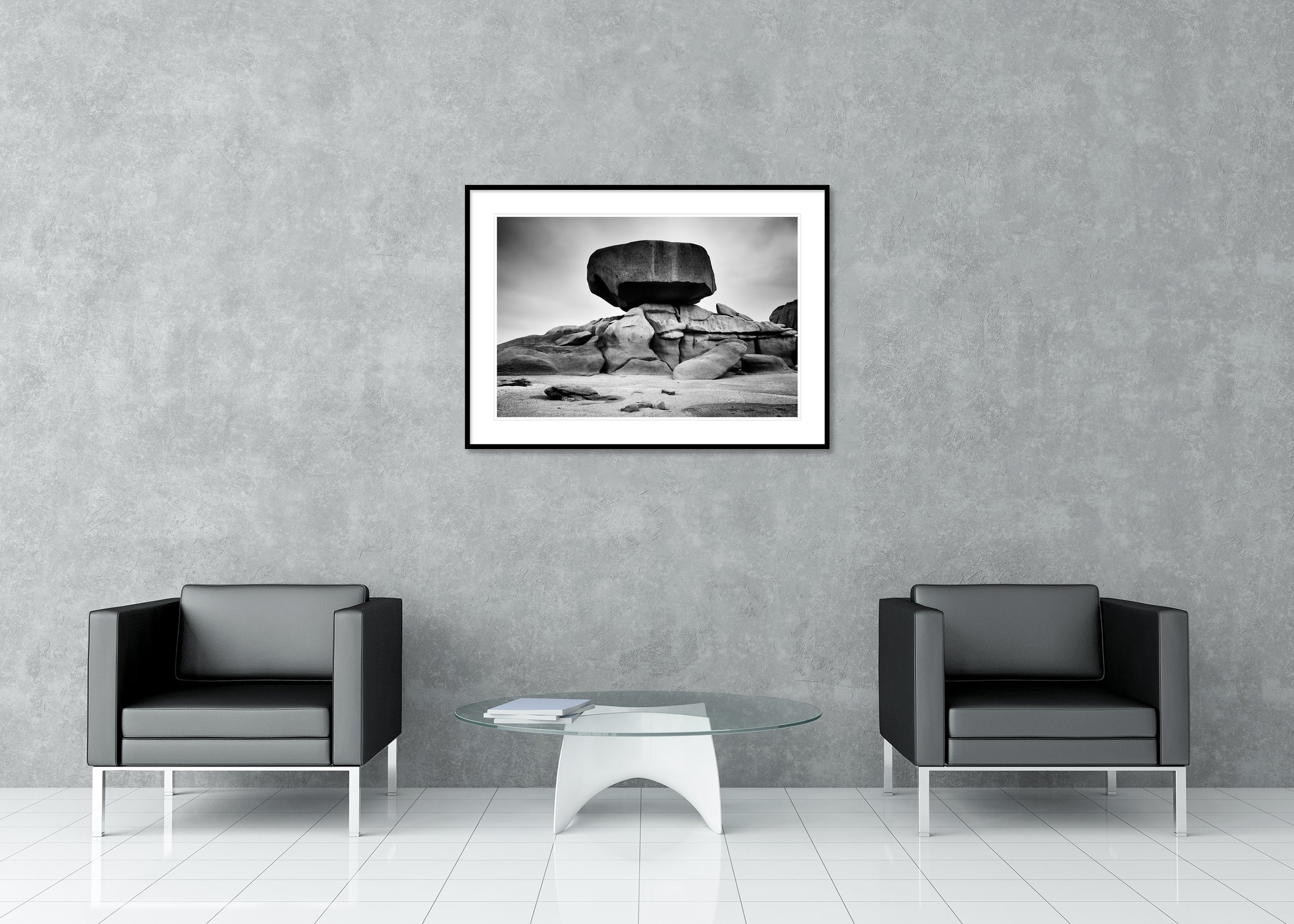 Pink granite rock formations on the Brittany coast in France above the Atlantic shoreline under stormy skies, archival pigment print in a classic frame with a mount.