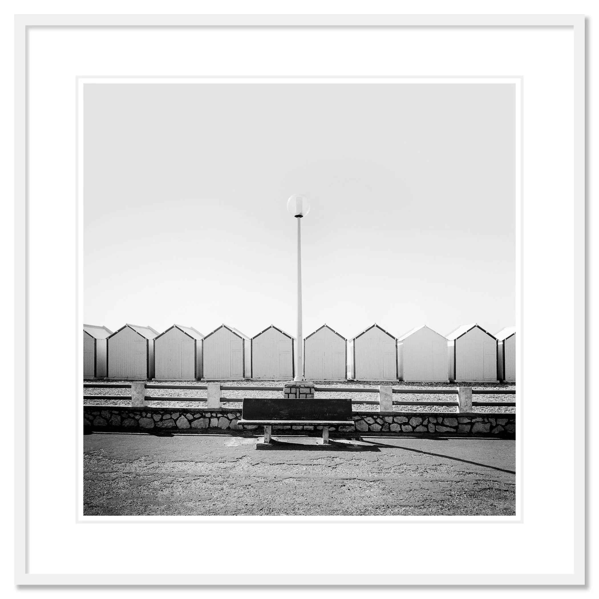 Bench on the Promenade Study 1 as an archival pigment print in a white aluminium frame with a white mount by Gerald Berghammer.