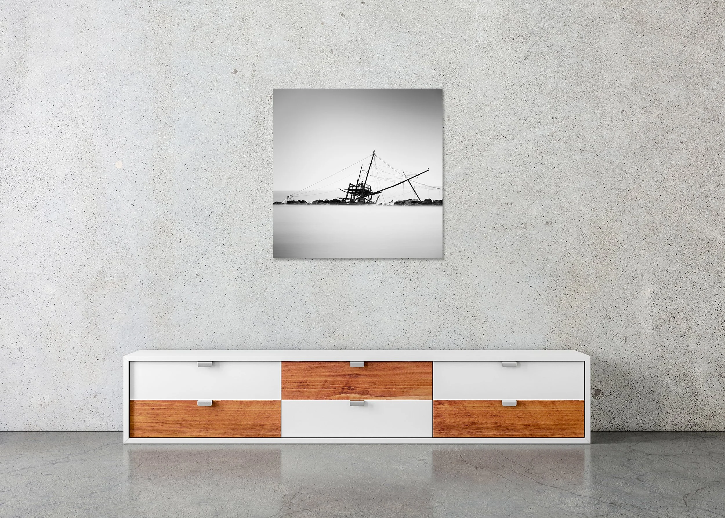 Black-and-white photo print of an abandoned fishing hut at Bocca d'Arno, mounted to Dibond and frameless, with calm water and a rocky shoreline.