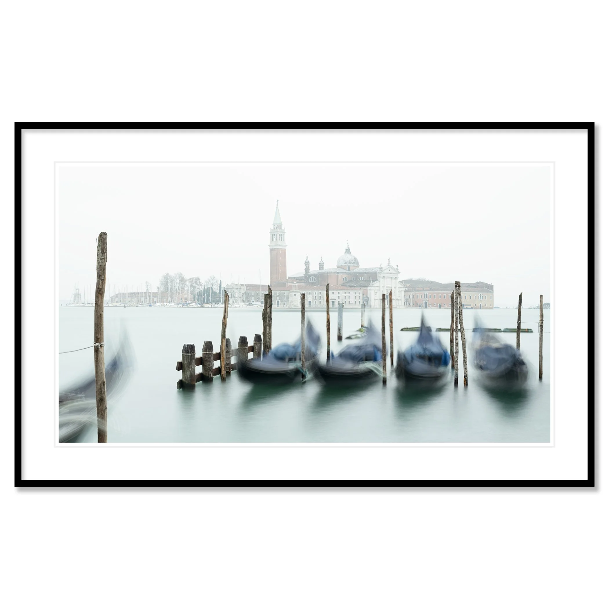 Gerald Berghammer - Color cityscape photography. Gondolas docked along wooden posts on a misty water canal and in back San Giorgio Maggiore Church. Classic framed black