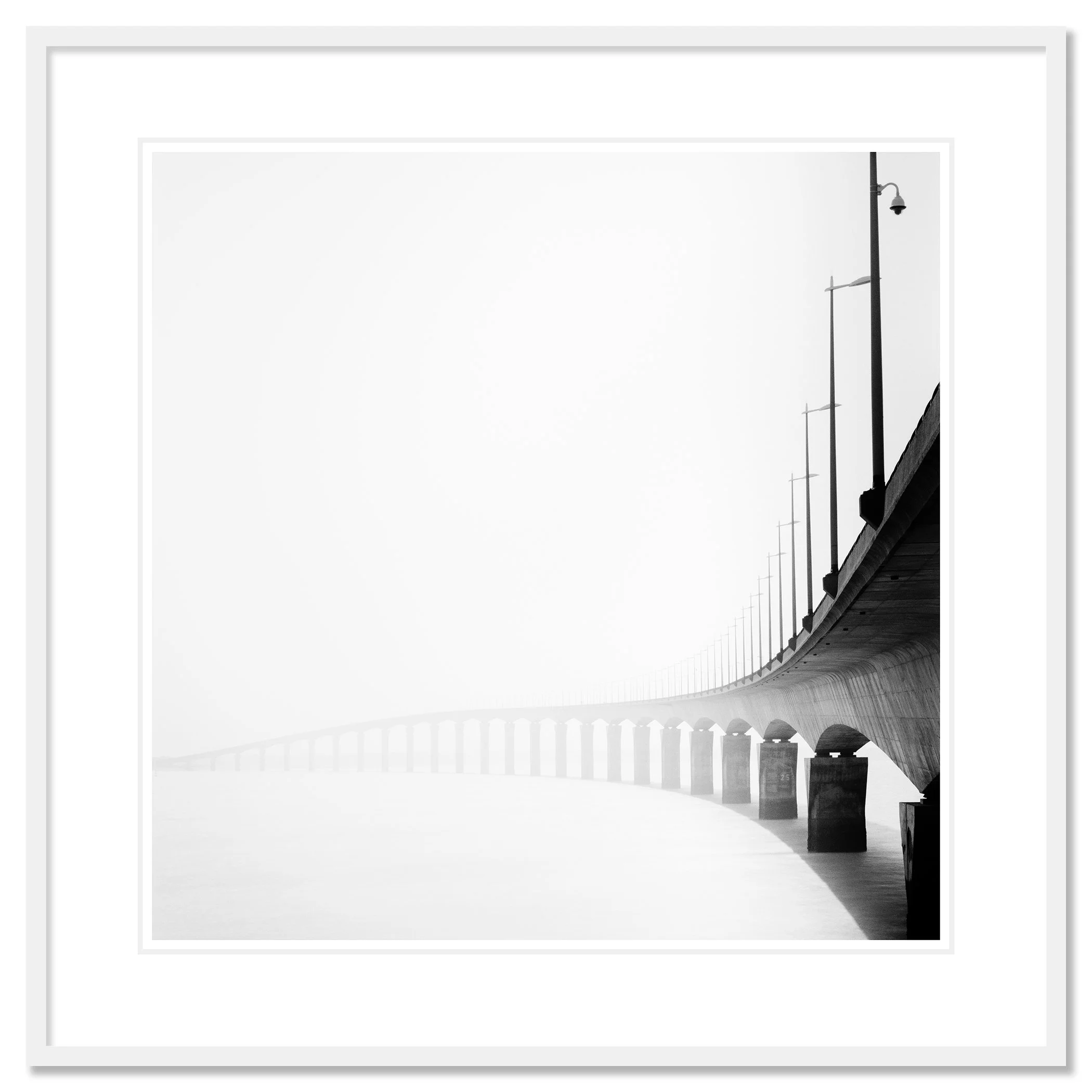 Pont de l’Île de Ré Study 1 as an archival pigment print in a white aluminium frame with a white mount by Gerald Berghammer.