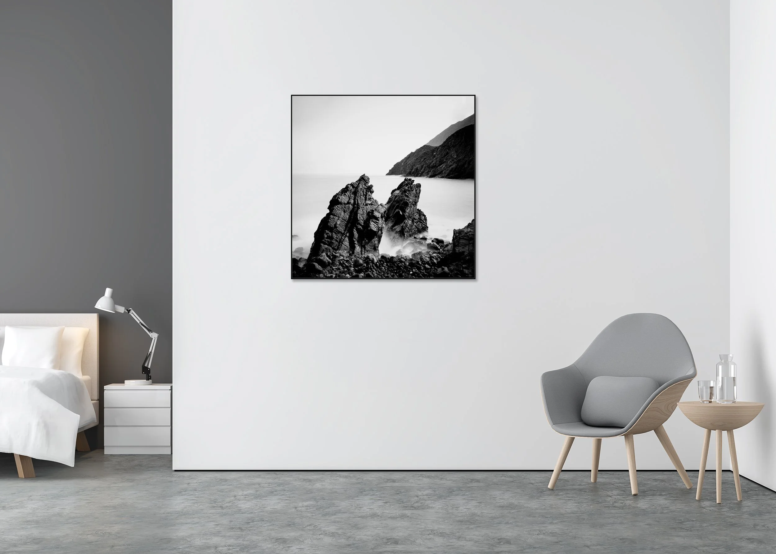 Black and white seascape print of rugged Atlantic rocks and distant mountains beneath a bright sky, mounted to Dibond in an aluminium ArtBox.