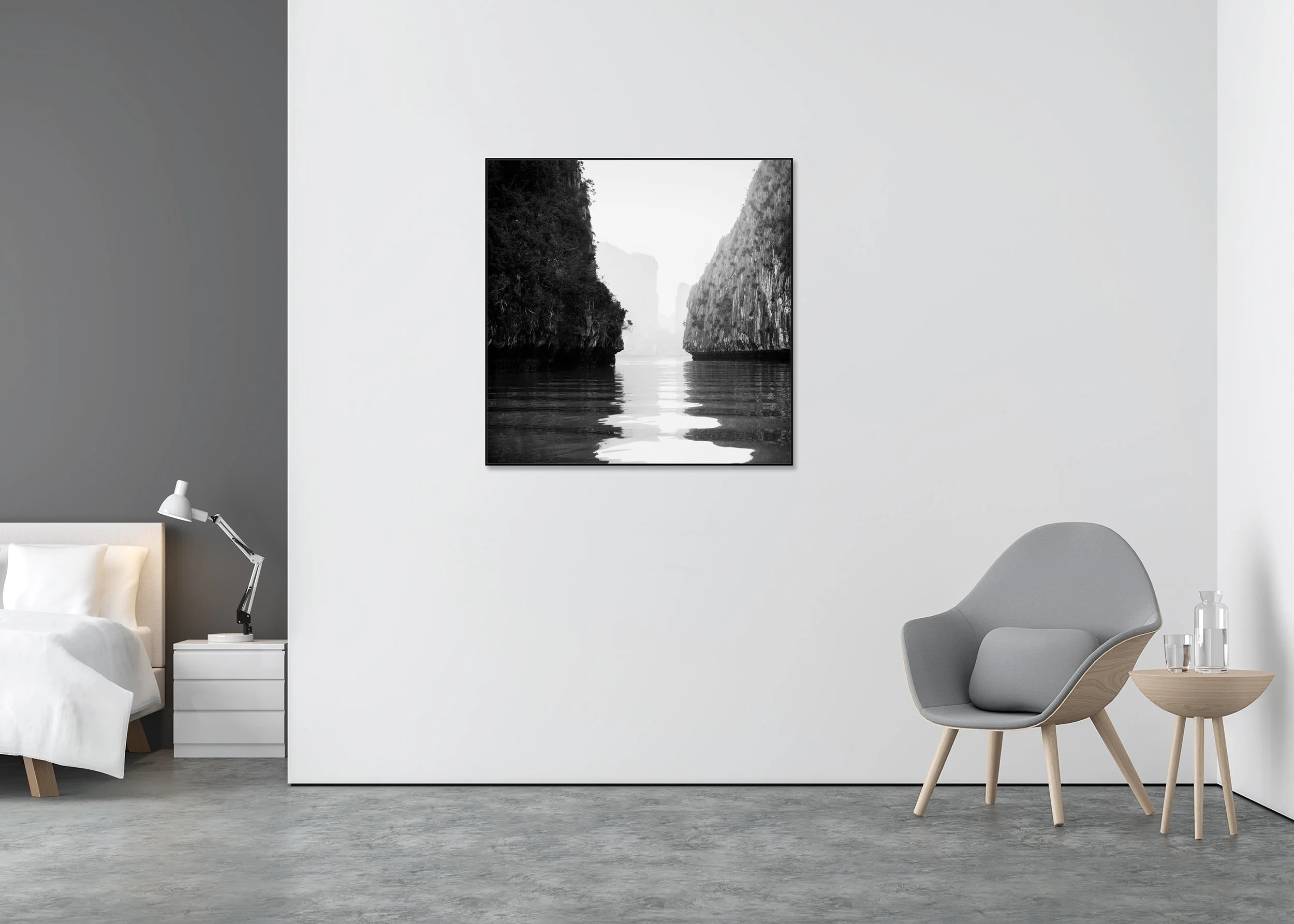 Black-and-white fine art photograph of Ha Long Bay karst limestone cliffs reflected in calm, still water, Vietnam, on a ChromaLuxe metal print in an aluminium ArtBox frame.