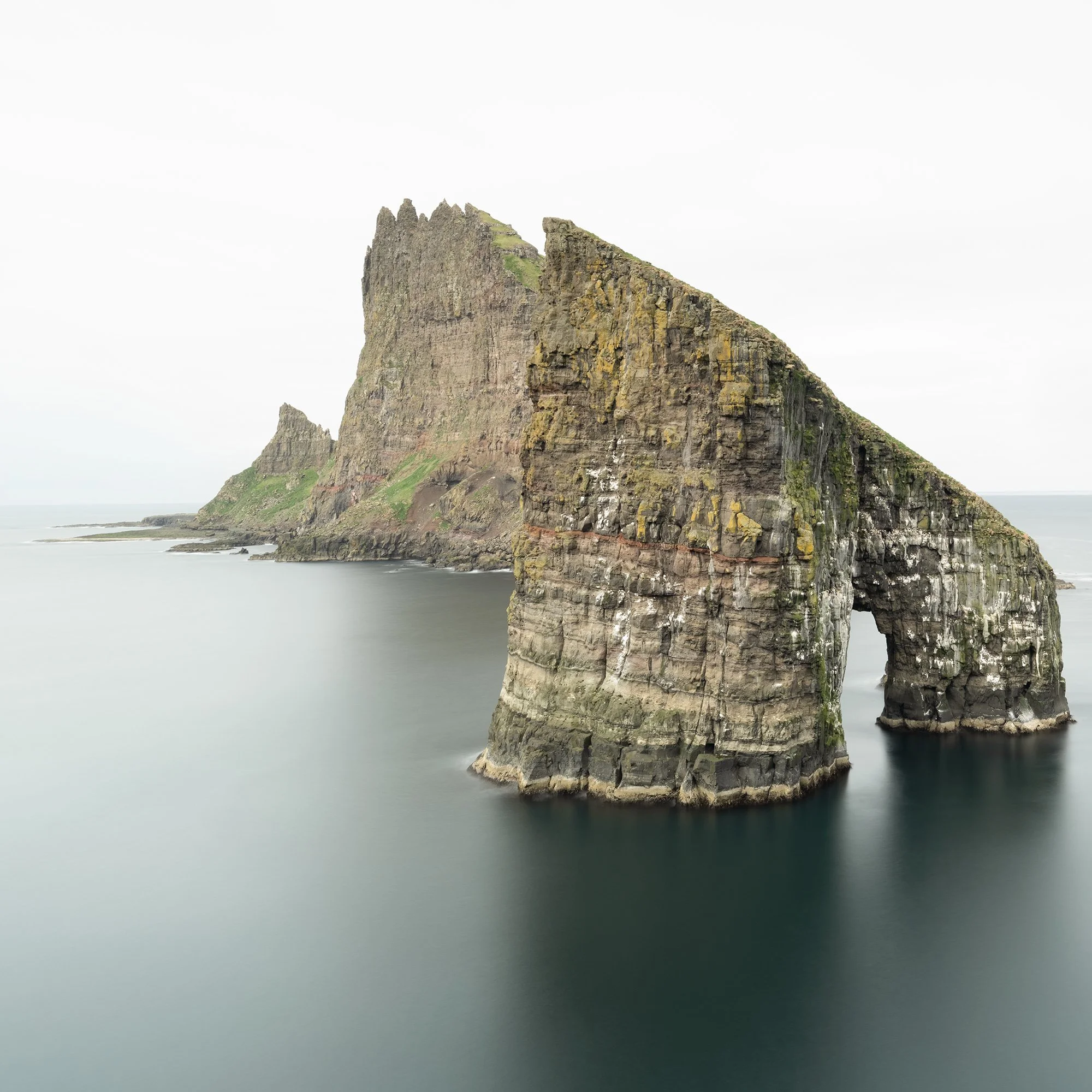 Gerald Berghammer - Color seascape panorama photography. Cliffs and sea stacks along a coastline under an overcast sky. Print detail 1