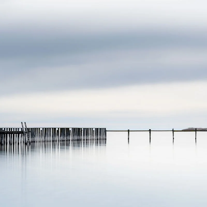 Swimming Area, Colour Study 1 by Gerald Berghammer, minimalist colour photograph of a wooden swimming structure surrounded by calm pale water in Austria.