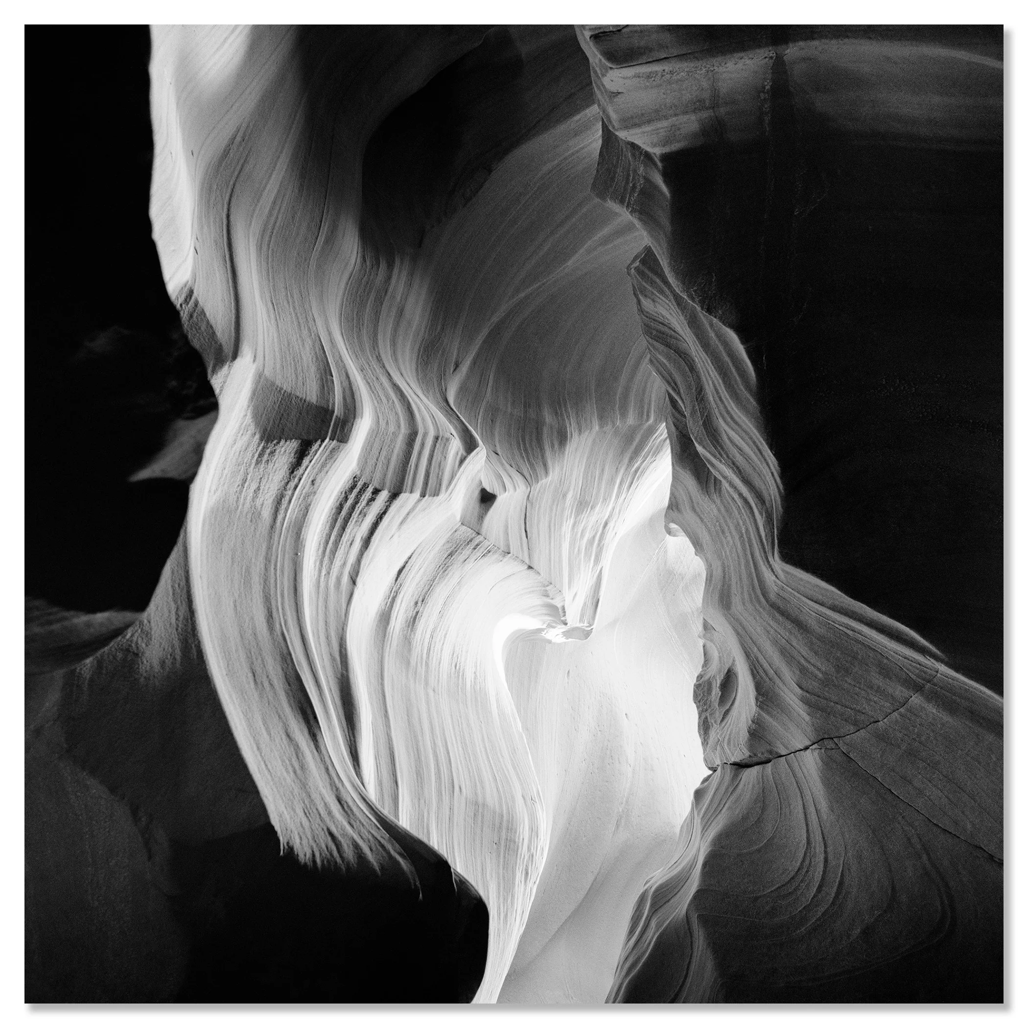 Black-and-white close-up of flowing sandstone curves and layered textures in Antelope Canyon – dibond frameless