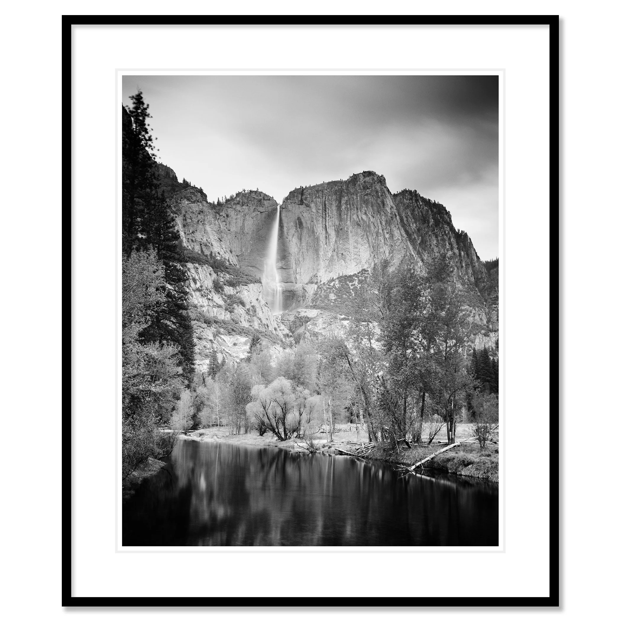 © 2015 Gerald Berghammer - Black and white american landscaspe photography. Mountain landscape with a waterfall, trees, and a calm river in the foreground. Classic framed black