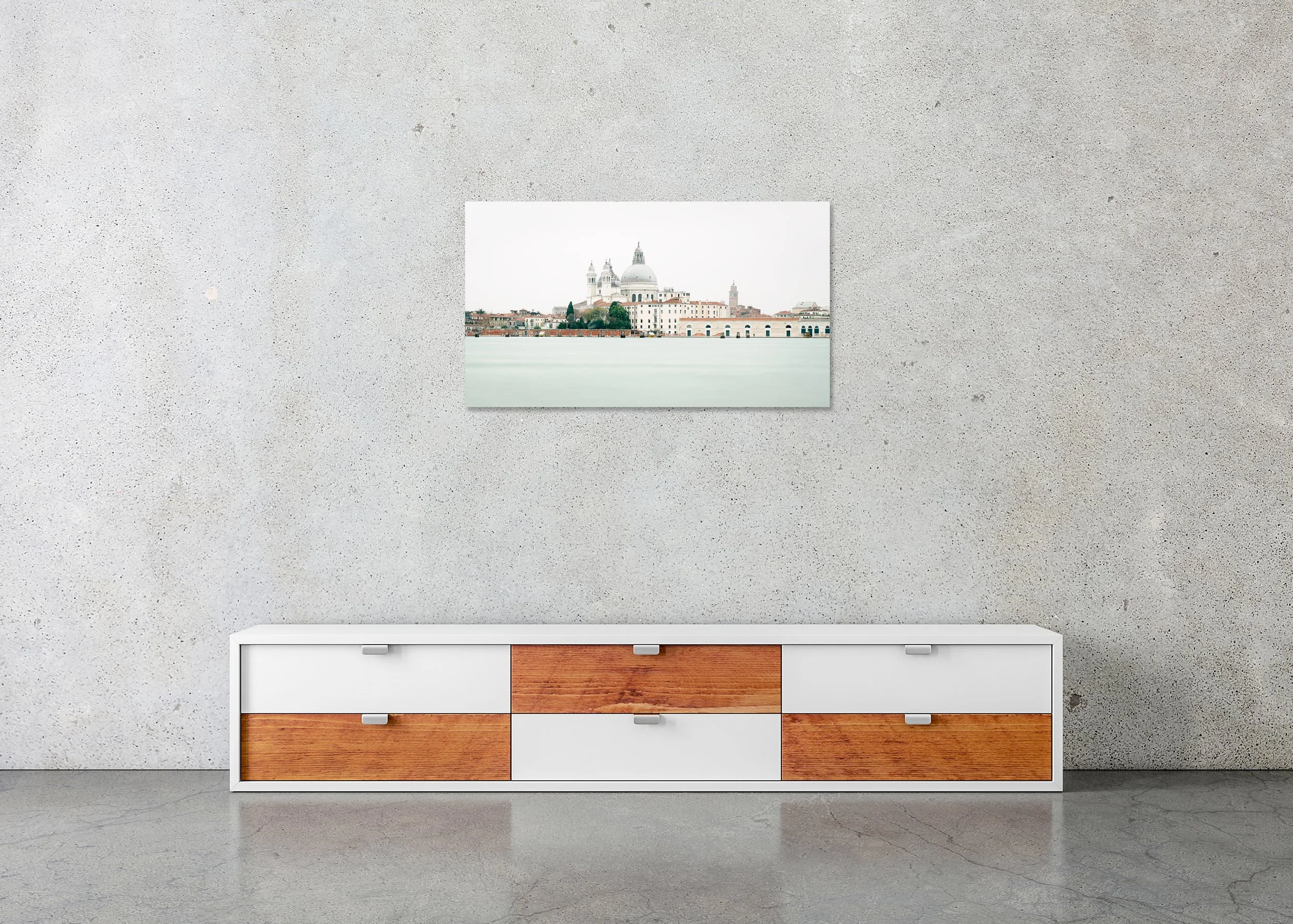 View of Venice, Panorama Study 2 – frameless colour photograph on aluminium Dibond displayed above a sideboard in a minimalist interior. Photo by Gerald Berghammer.