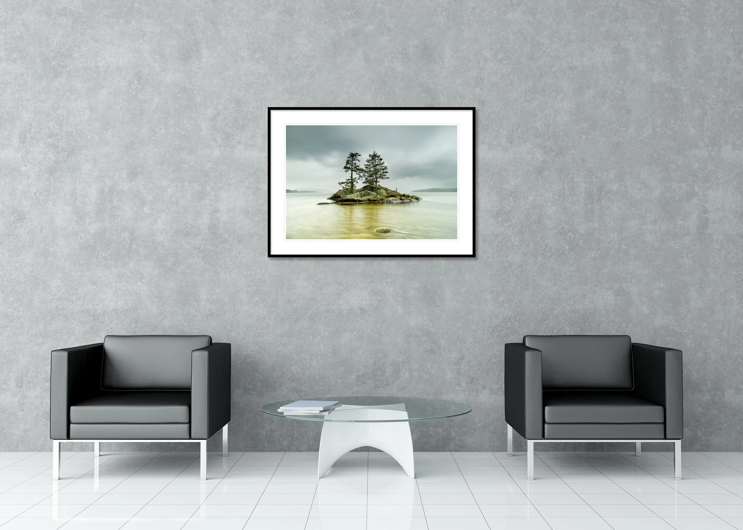 Small rocky island with two pine trees in calm lake water, long-exposure landscape under an overcast sky, archival pigment print in a classic frame with passe-partout.