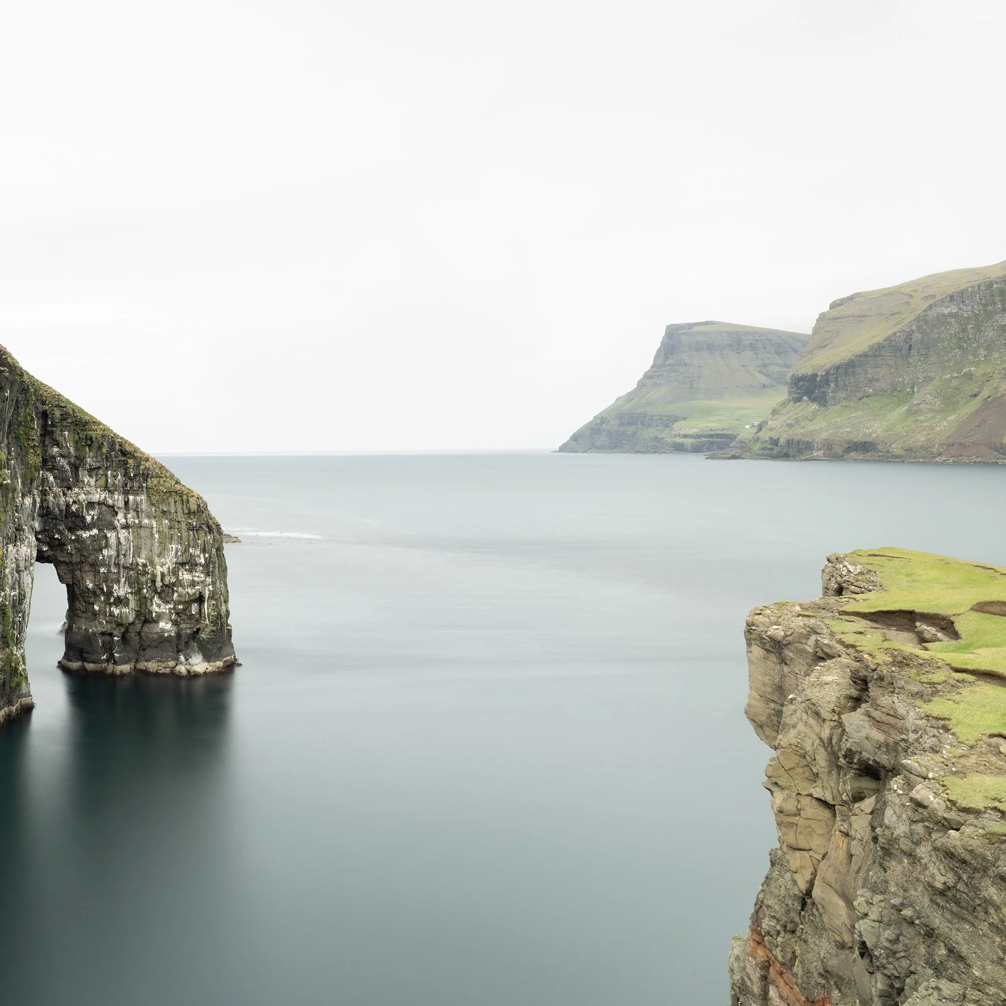 Gerald Berghammer - Color seascape panorama photography. Cliffs and sea stacks along a coastline under an overcast sky. Print detail 2