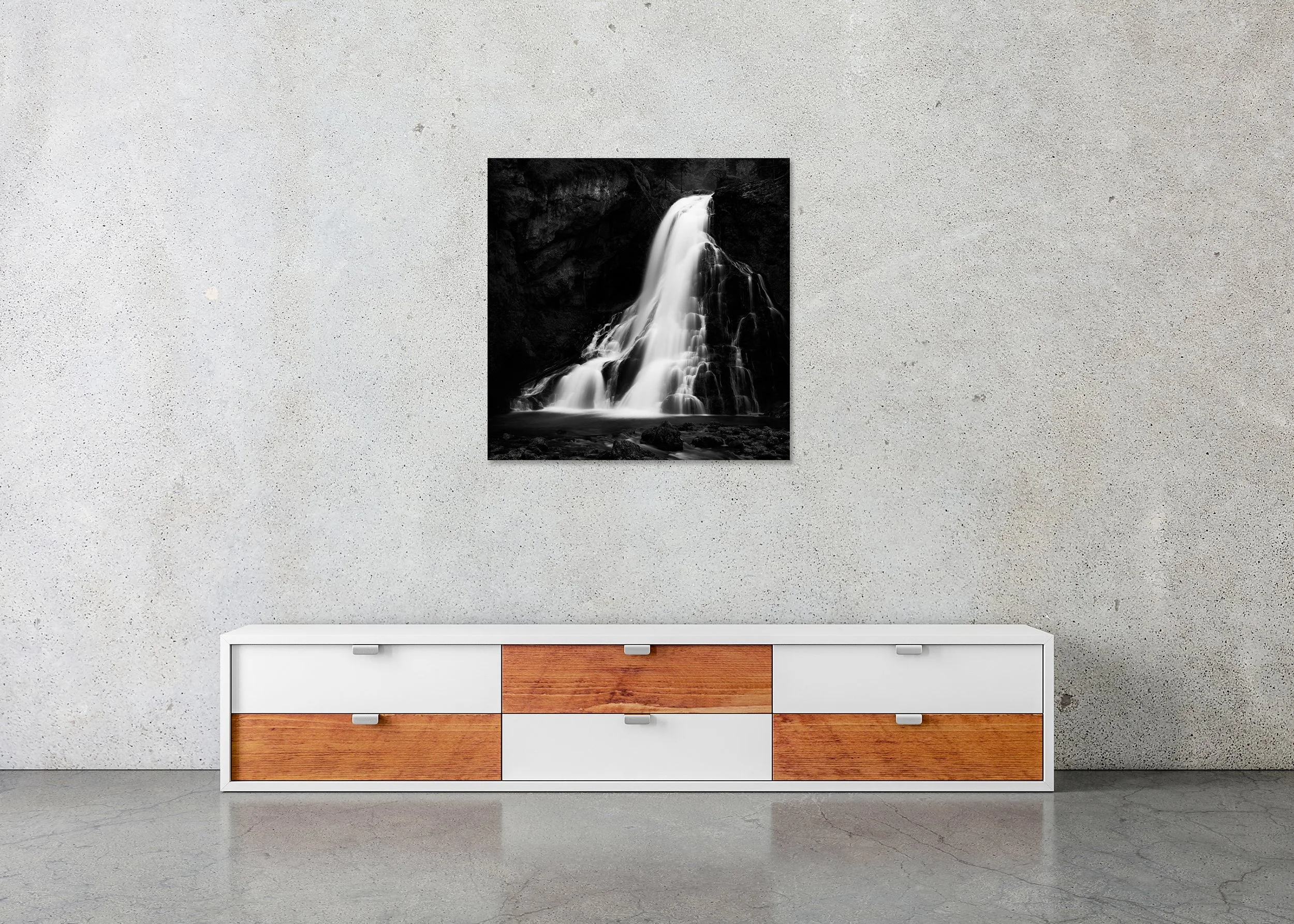 Golling Waterfalls Study 2 displayed in a modern interior as a frameless black-and-white print mounted on aluminium Dibond by Gerald Berghammer.