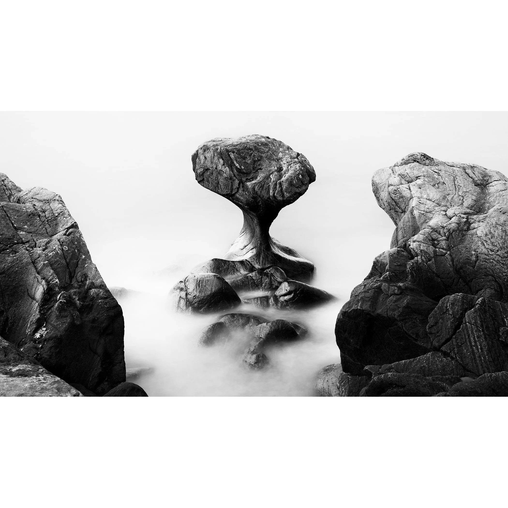 Attracted by the Sea Study 1 by Gerald Berghammer, minimalist black-and-white long-exposure seascape of a sculptural rock formation in Norway.