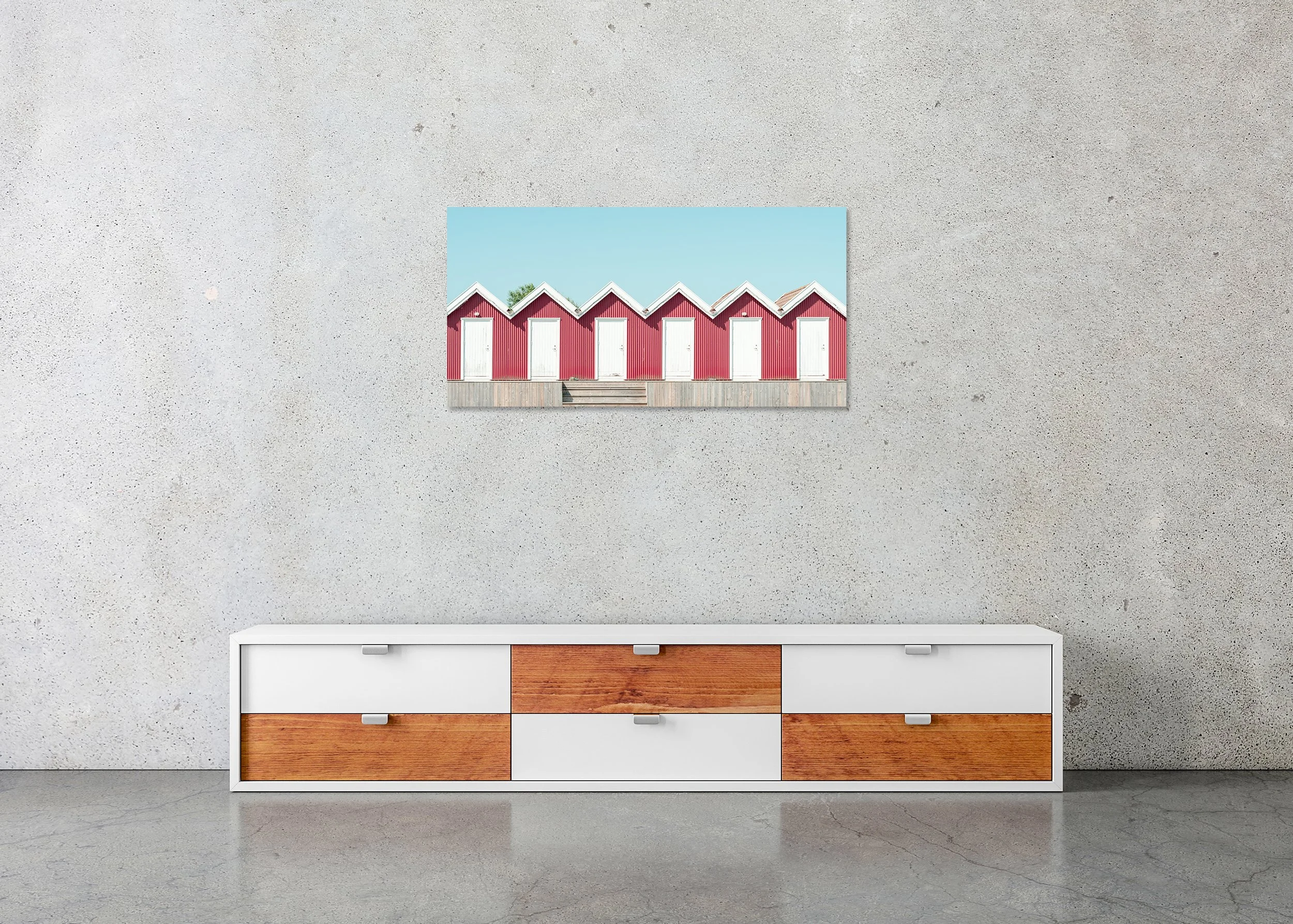 Red Beach Huts Study 1 displayed in a modern interior as a frameless colour artwork mounted on aluminium Dibond by Gerald Berghammer.