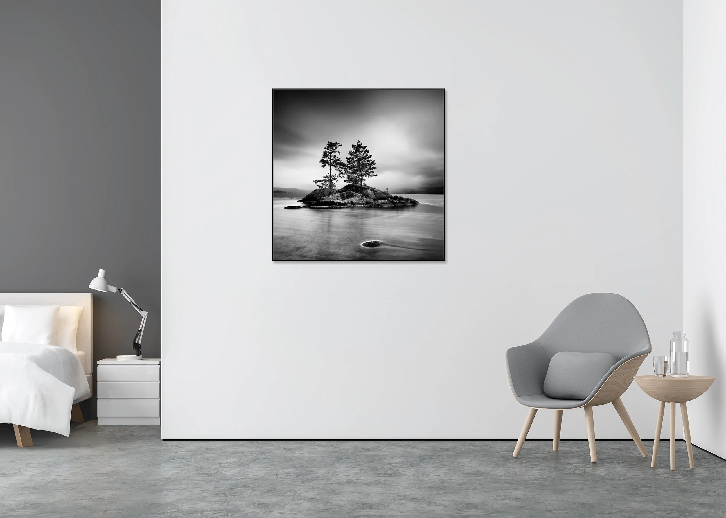 Black and white landscape print of two pine trees on a rocky island in a calm lake under a cloudy sky, mounted to Dibond in an aluminium ArtBox