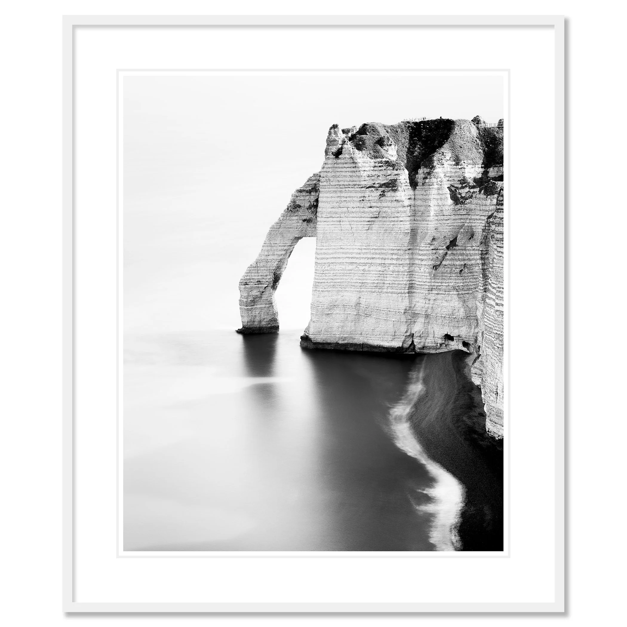 The Sea Arch at Étretat, France, black-and-white pigment print in a white aluminium frame with mount. Photo by Gerald Berghammer.