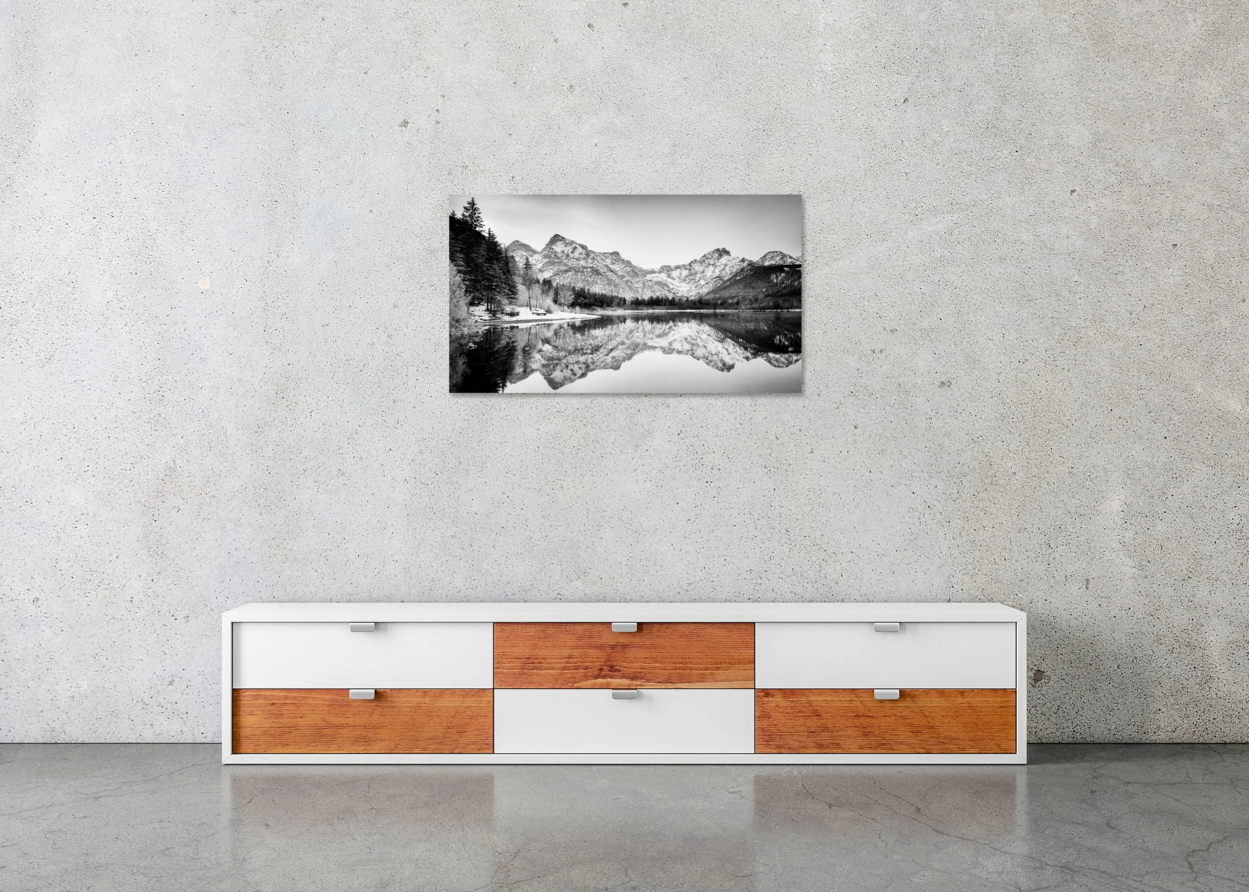 White Mountains, Almsee, Austria, displayed in a modern interior as a frameless black-and-white artwork mounted on aluminium Dibond by Gerald Berghammer.