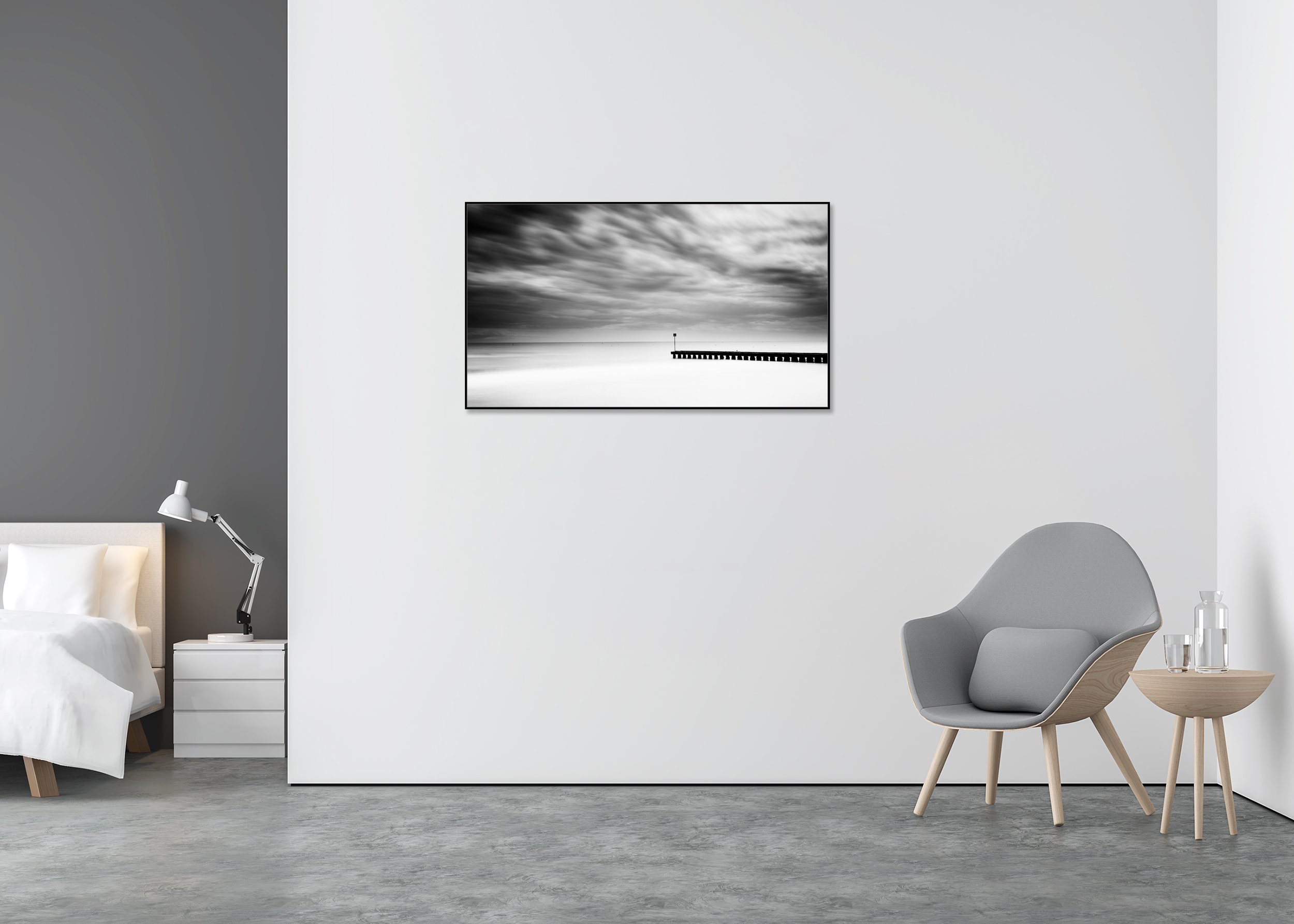 Black and white seascape print with dramatic clouds and a wooden pier over calm water, mounted to Dibond in an aluminium ArtBox.