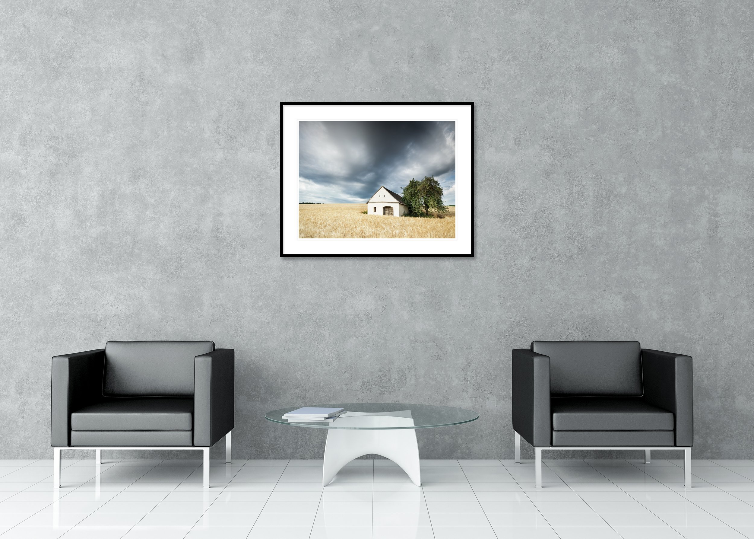 Historic wine press house in a golden field under dramatic overcast sky, archival pigment print in a classic frame with mount