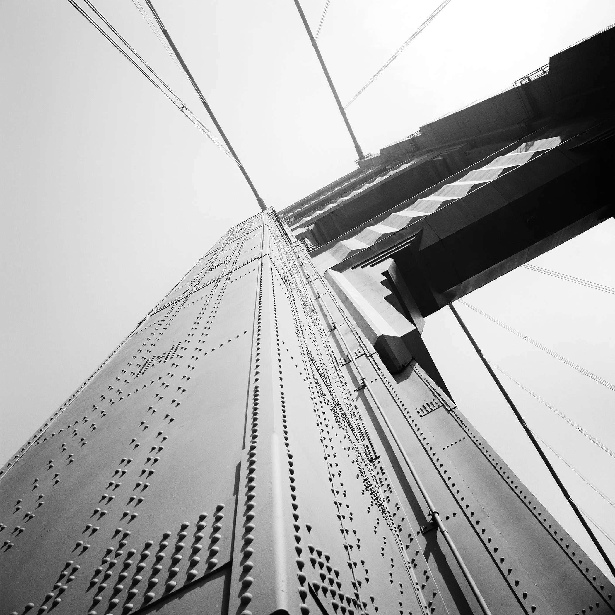 Black-and-white architectural photograph of the Golden Gate Bridge in California, USA, by Gerald Berghammer.